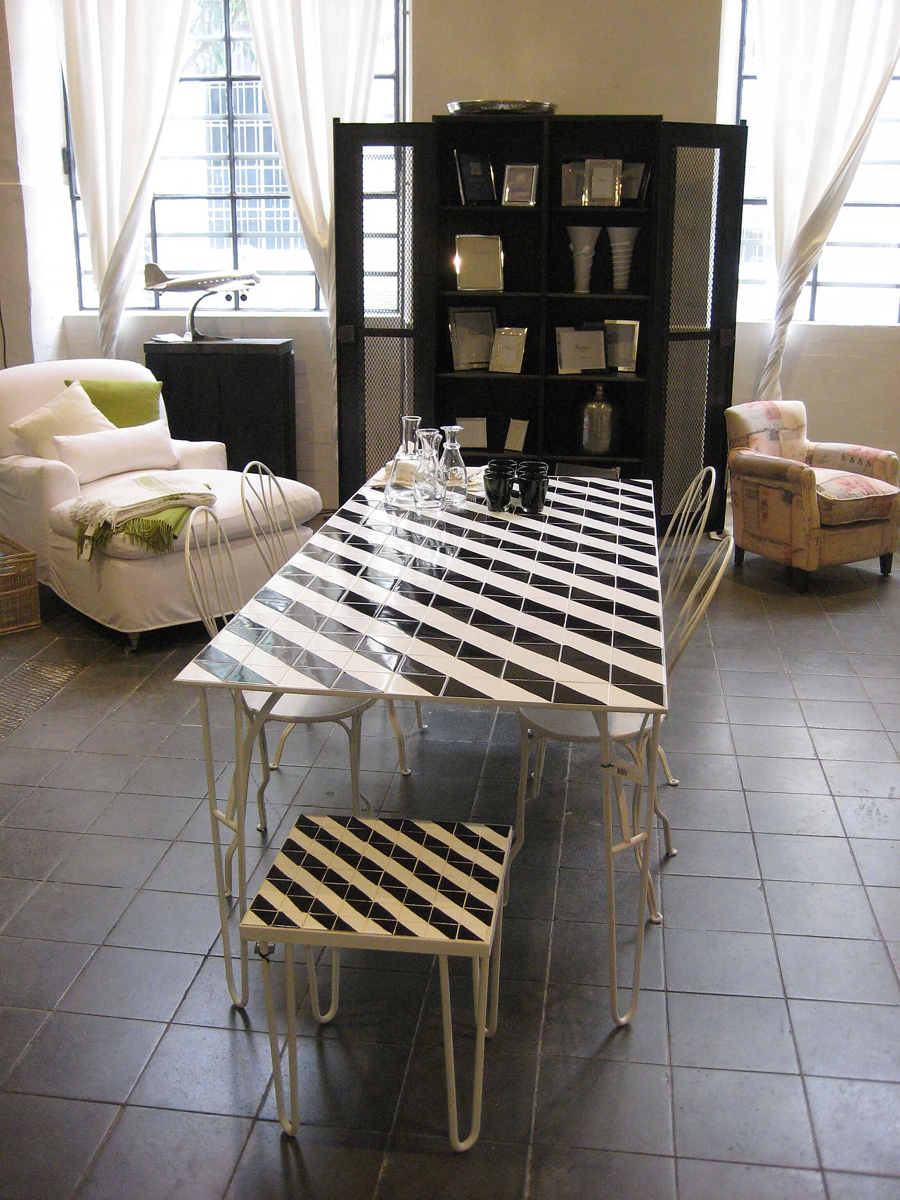 Iron table with black and white ceramic tile top 1282909