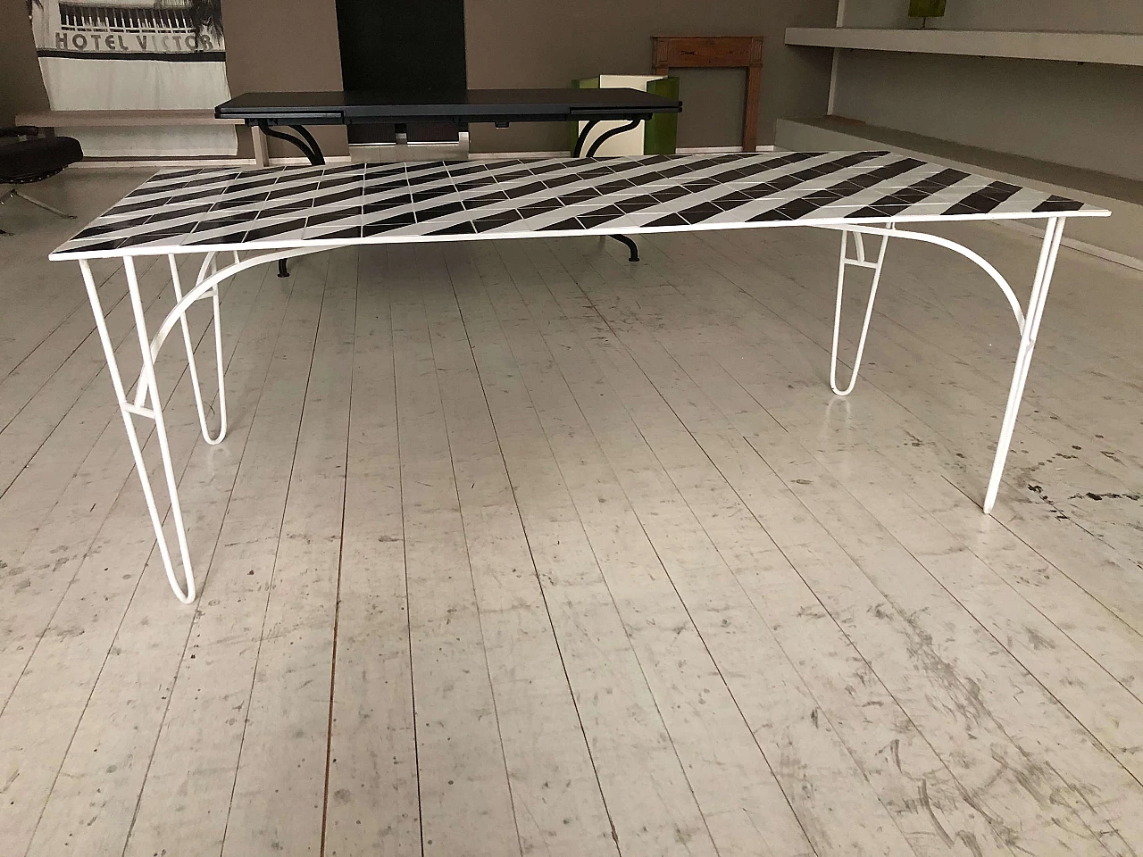 Iron table with black and white ceramic tile top 1282912