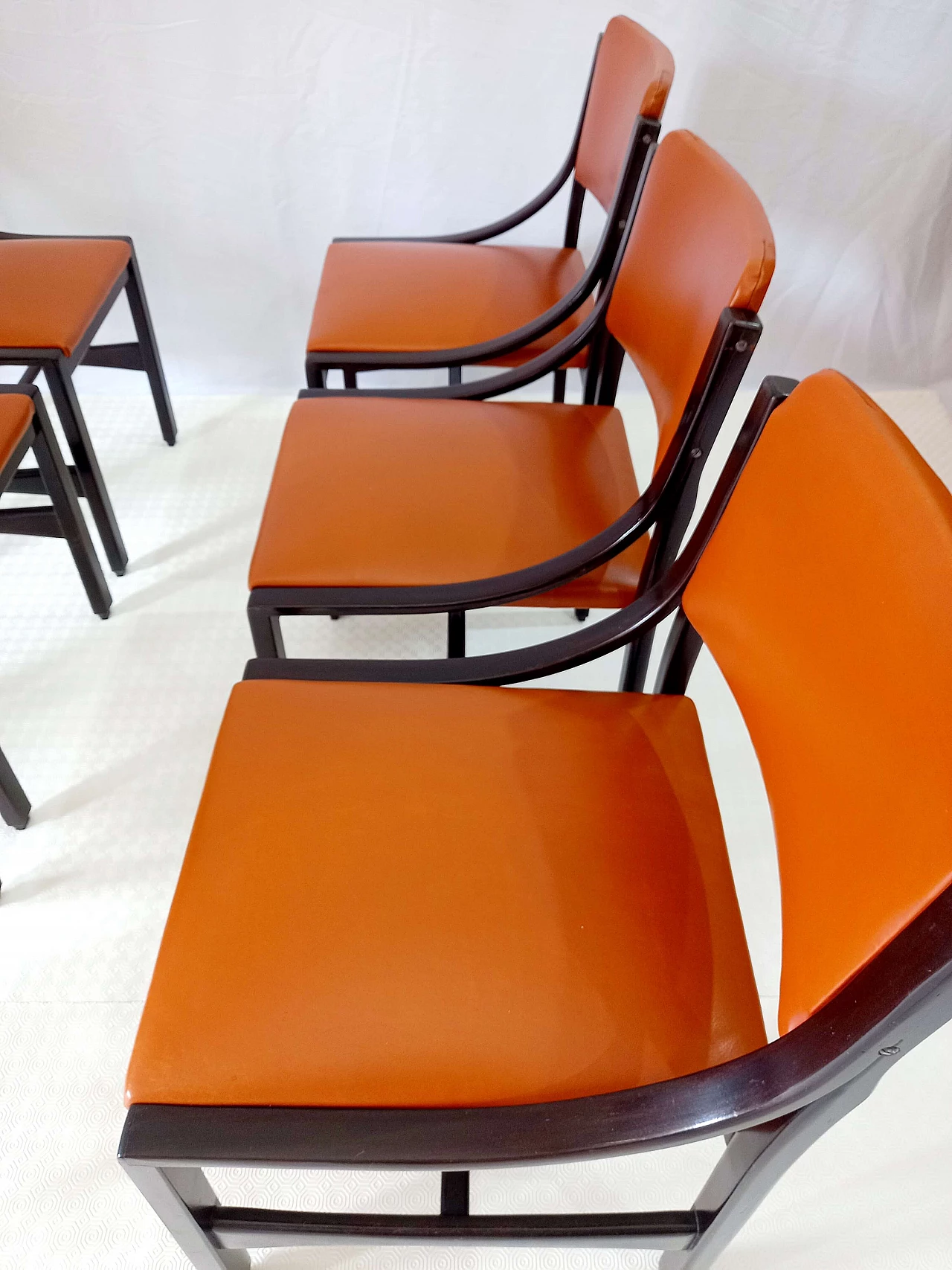 6 Orange and rosewood leather dining chairs, 1970s 7