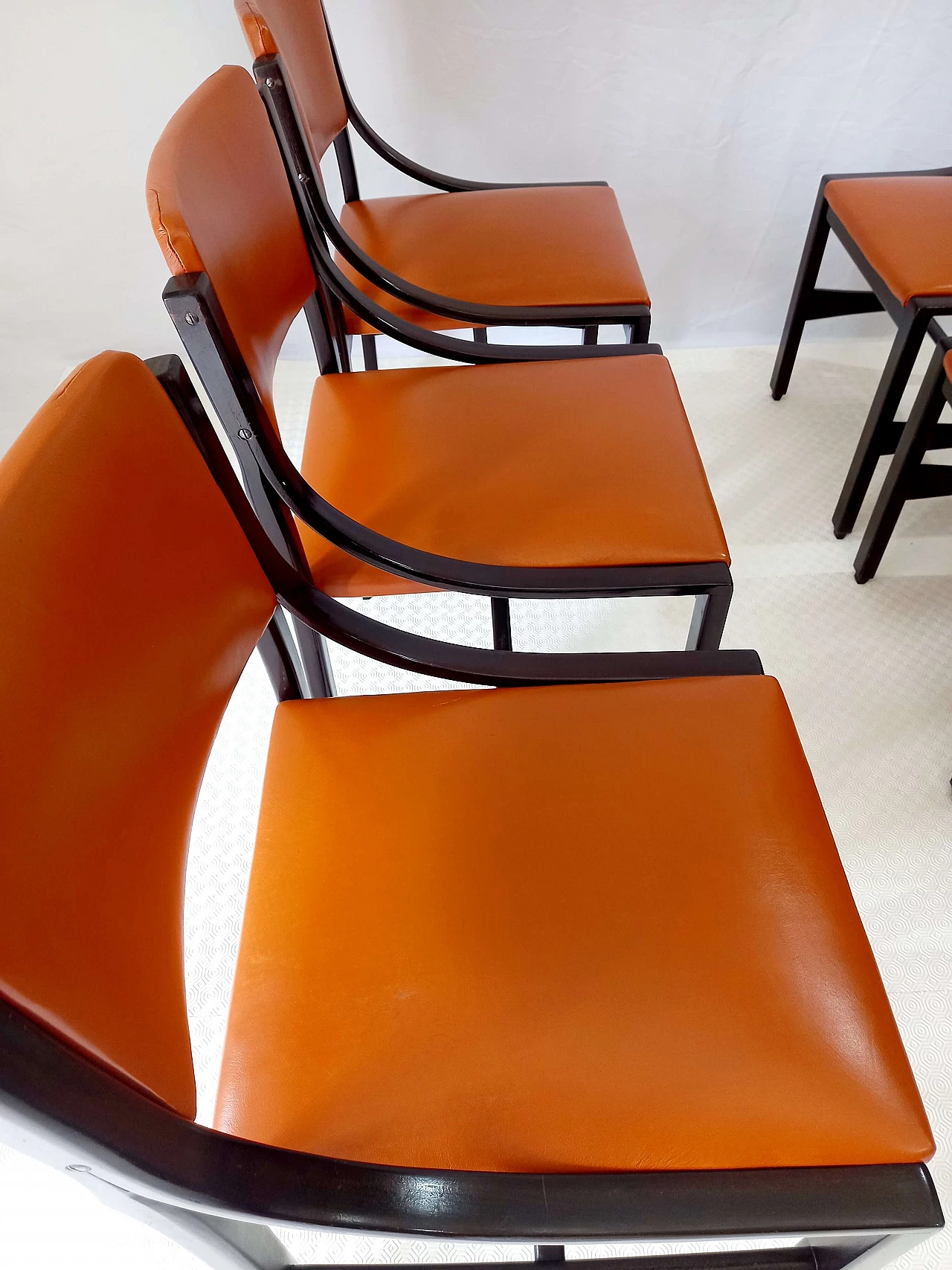 6 Orange and rosewood leather dining chairs, 1970s 8