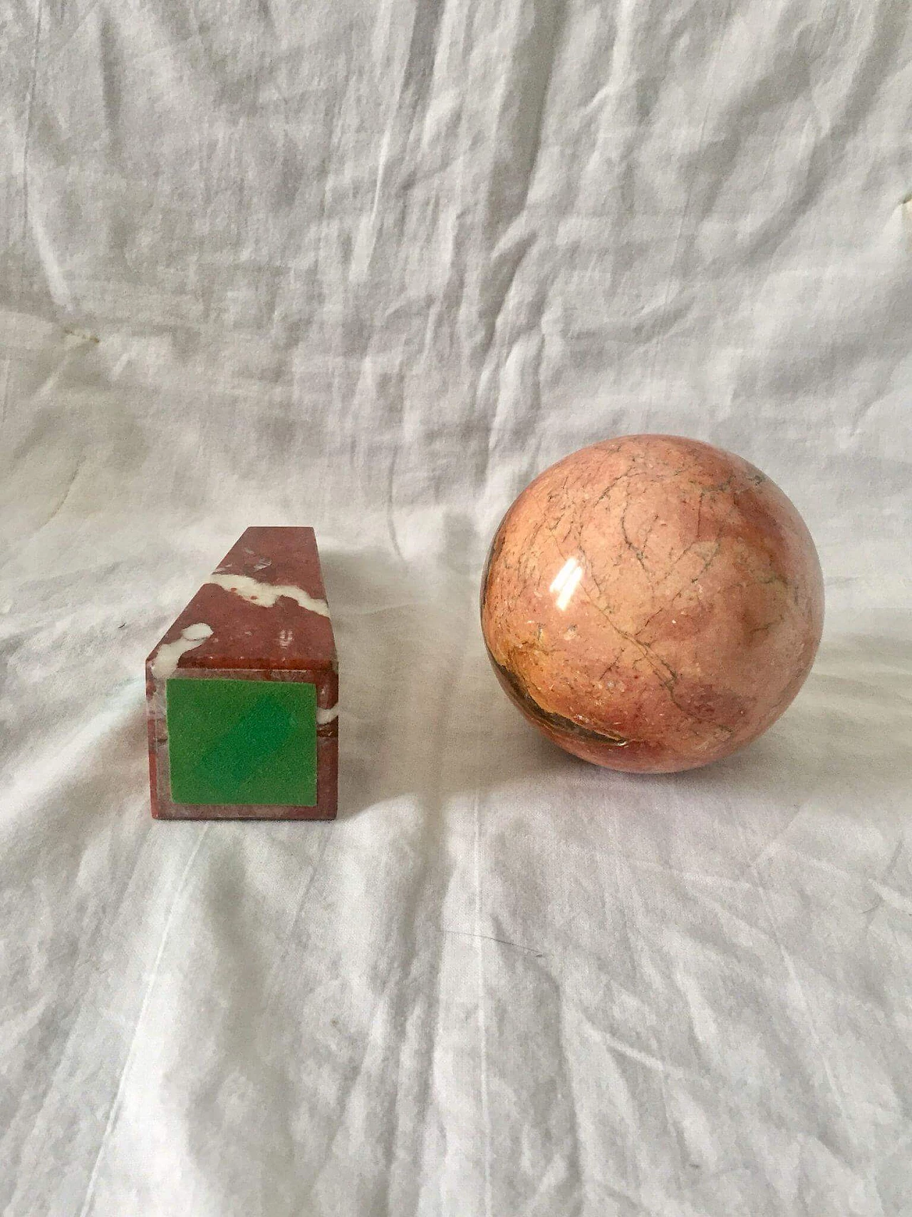 Pair of marble objects in the shape of a sphere and obelisk, 1940s 1