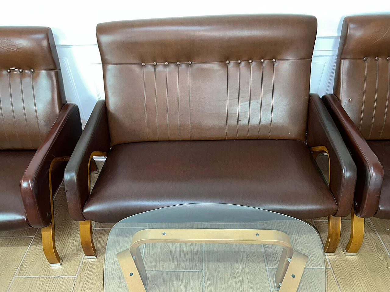 Sofa and pair of armchairs in leather and glass side table, 1960s 12