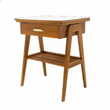 Wood coffee table with magazine rack and drawer, 1960s