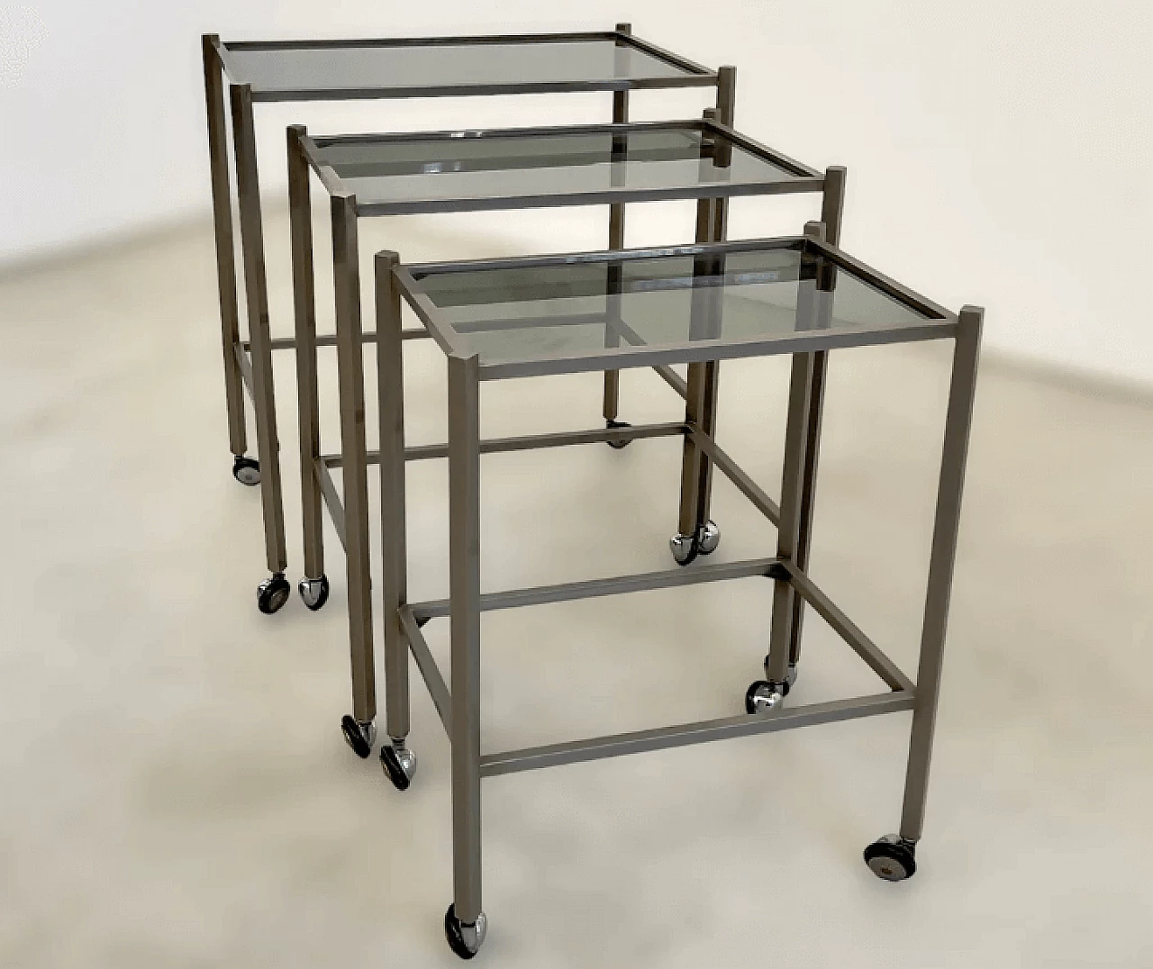 3 Nesting tables in metal and smoked glass attributed to Saporiti, 1970s 1