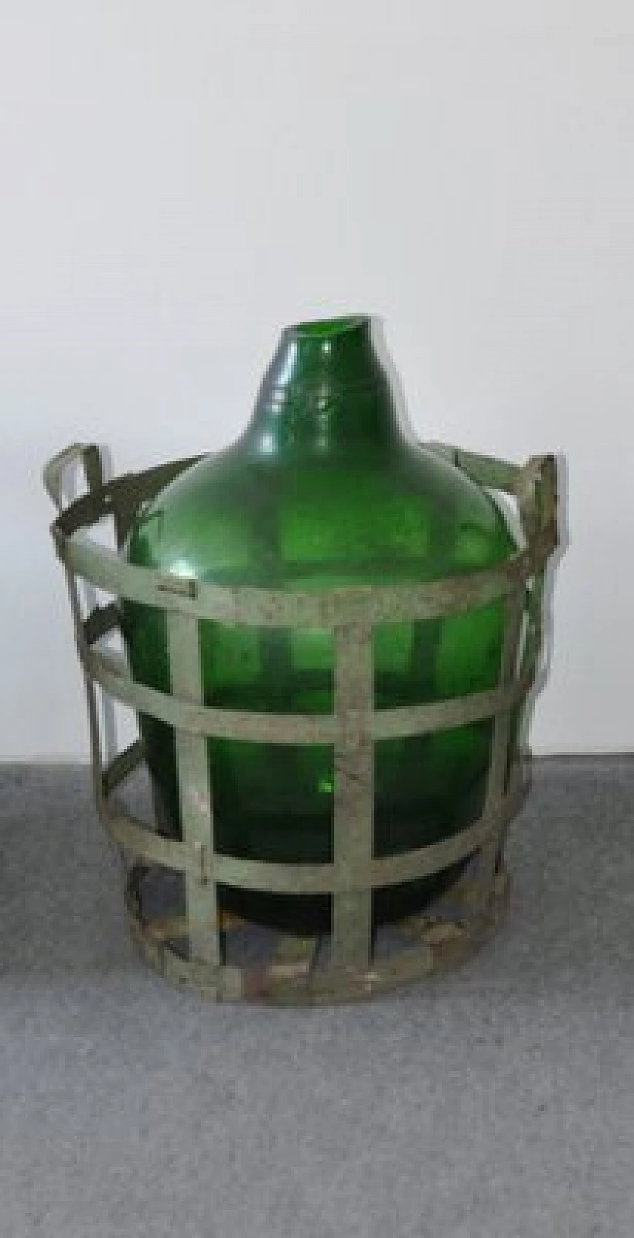 Blown green glass bottle with metal basket 1