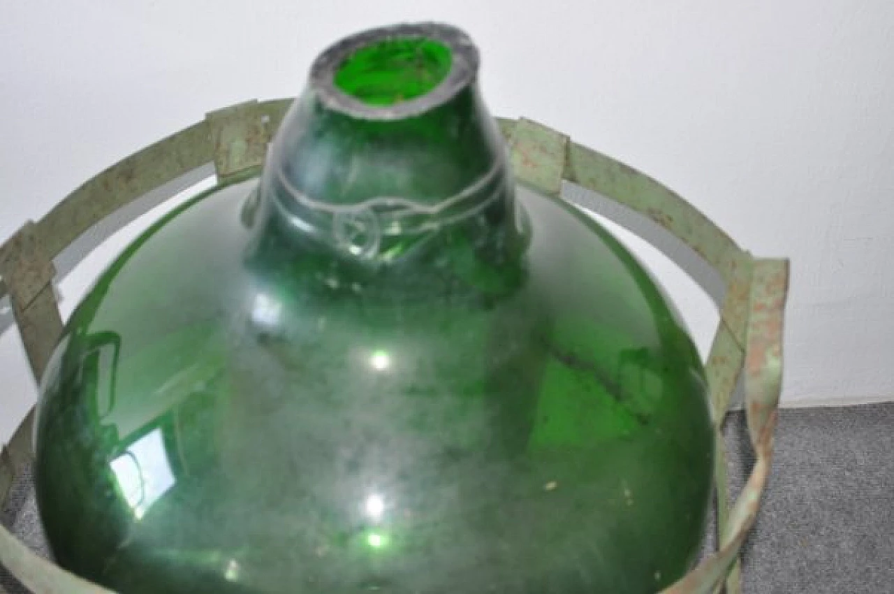 Blown green glass bottle with metal basket 2