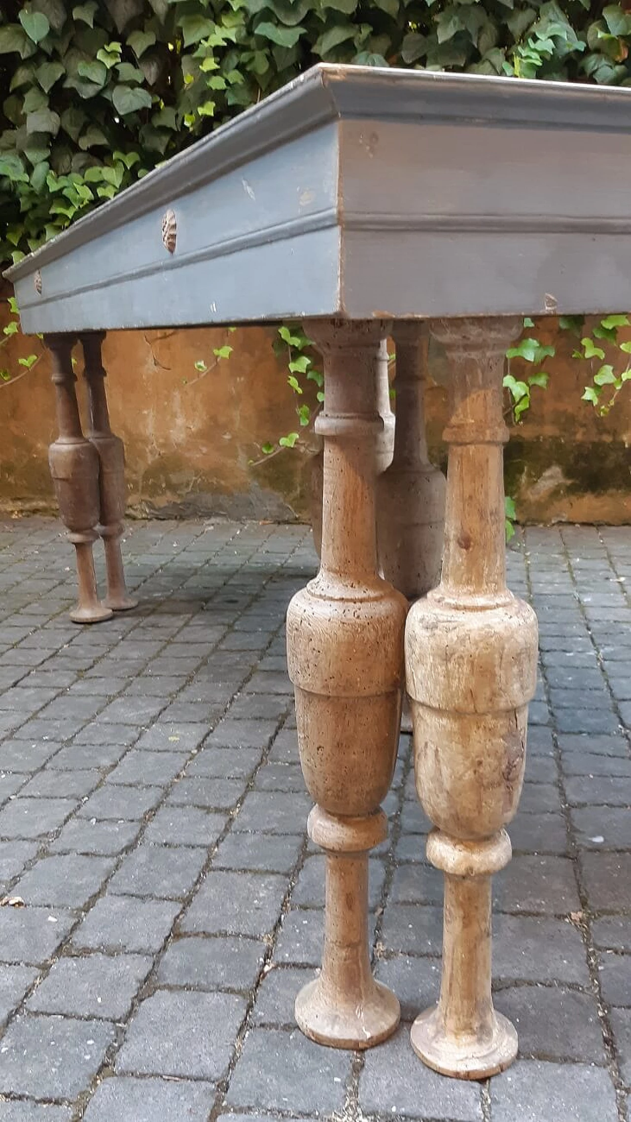 Table with 19th-century mirrored top and 18th-century spool legs, early 20th century 1