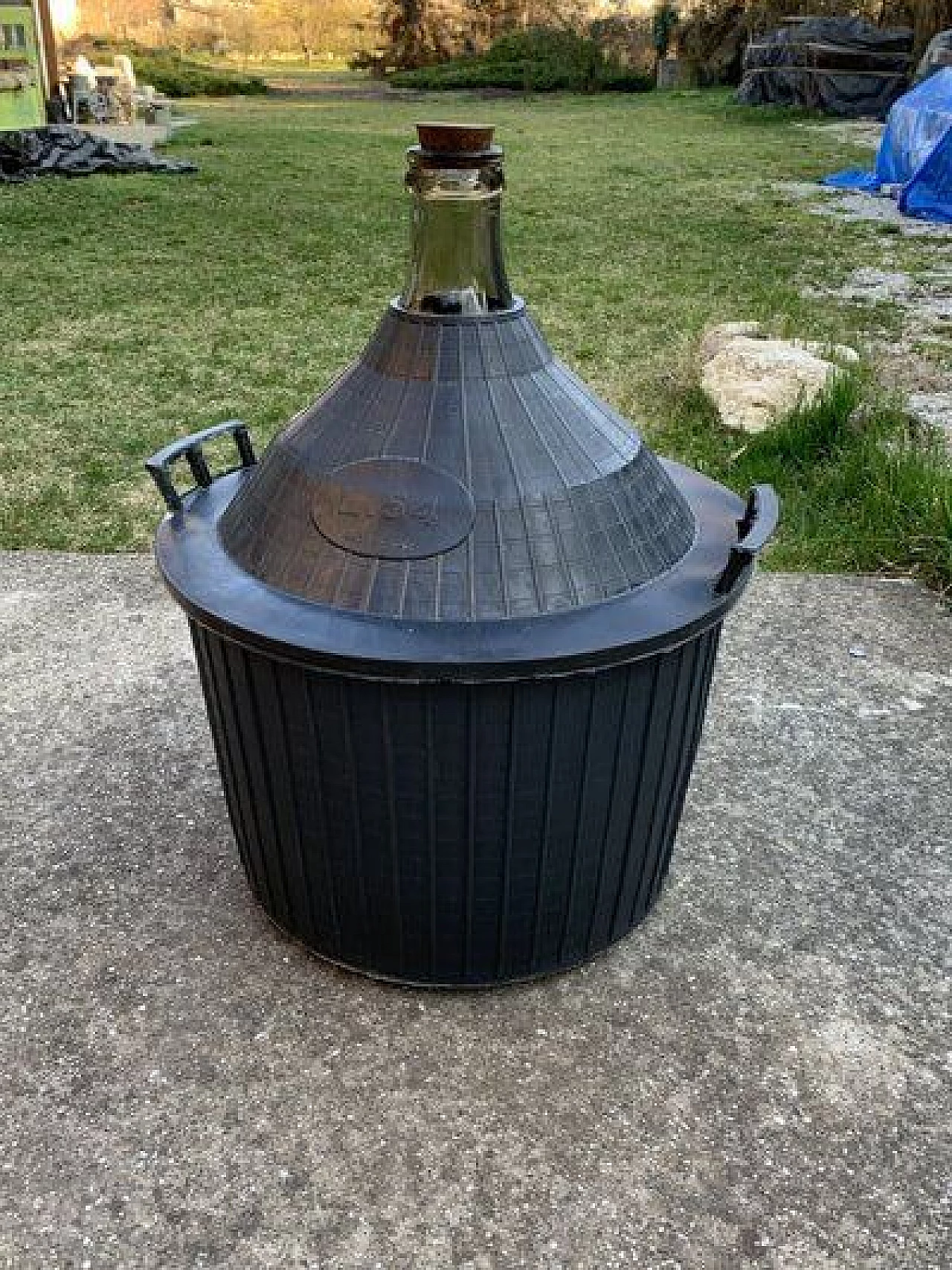 Glass demijohn with plastic basket, 1950s 1