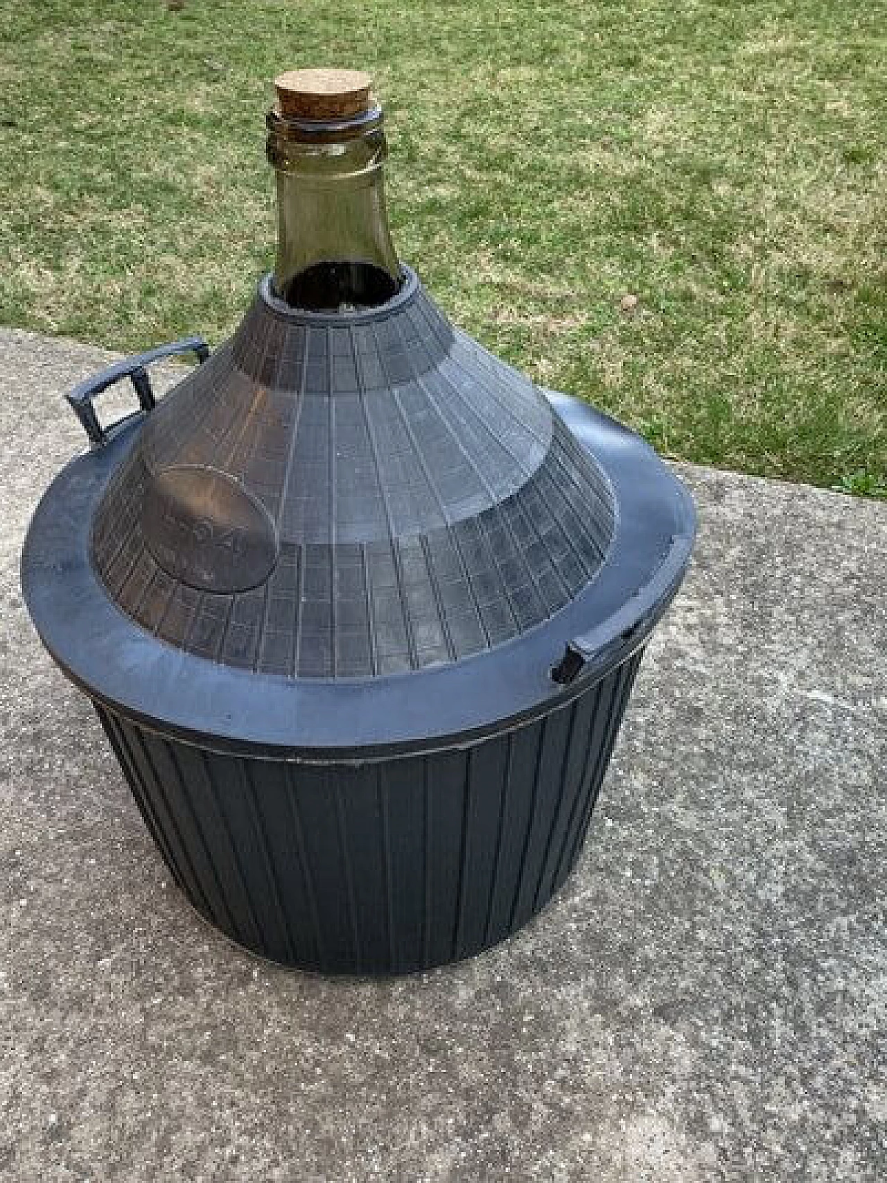 Glass demijohn with plastic basket, 1950s 2