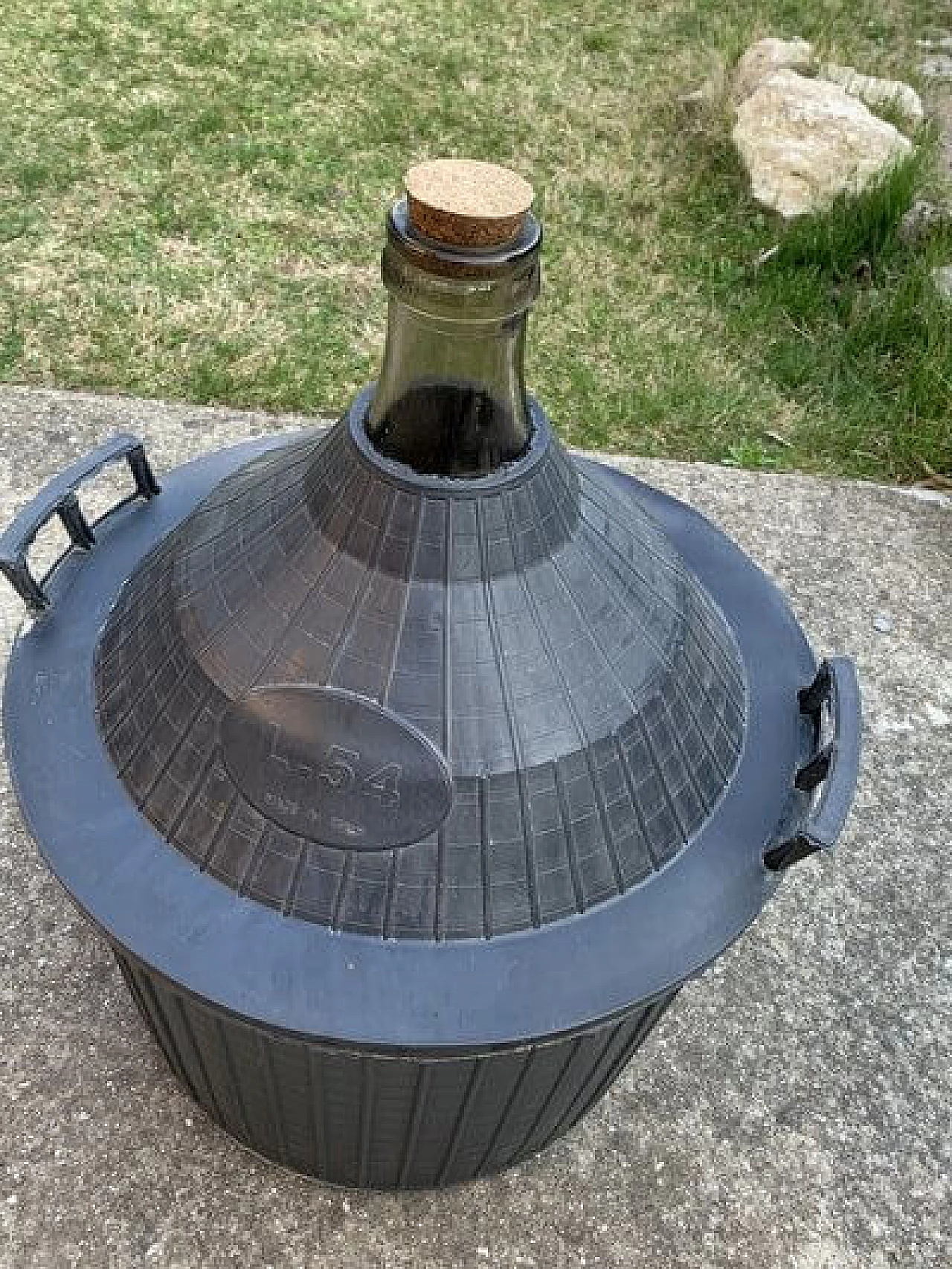 Glass demijohn with plastic basket, 1950s 6