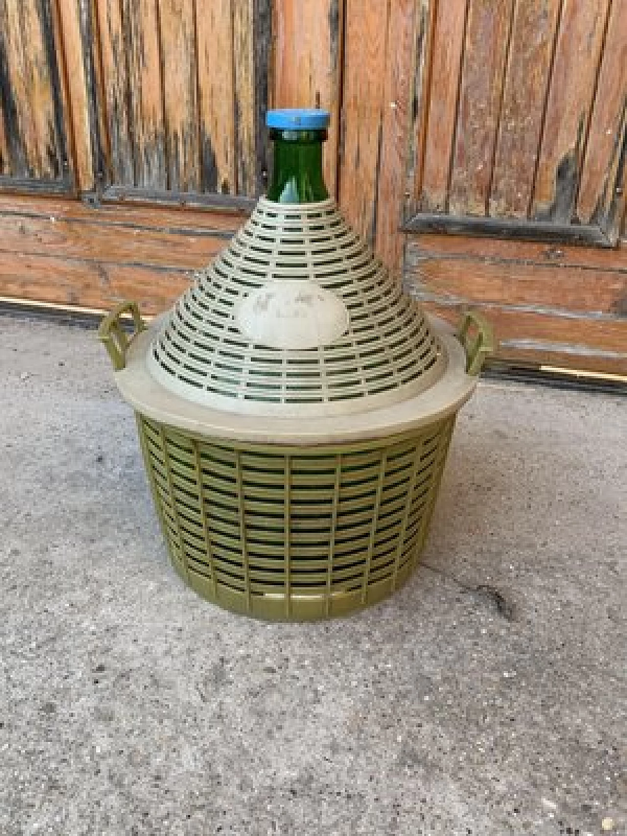 Hungarian green glass demijohn with plastic basket, 1950s 1