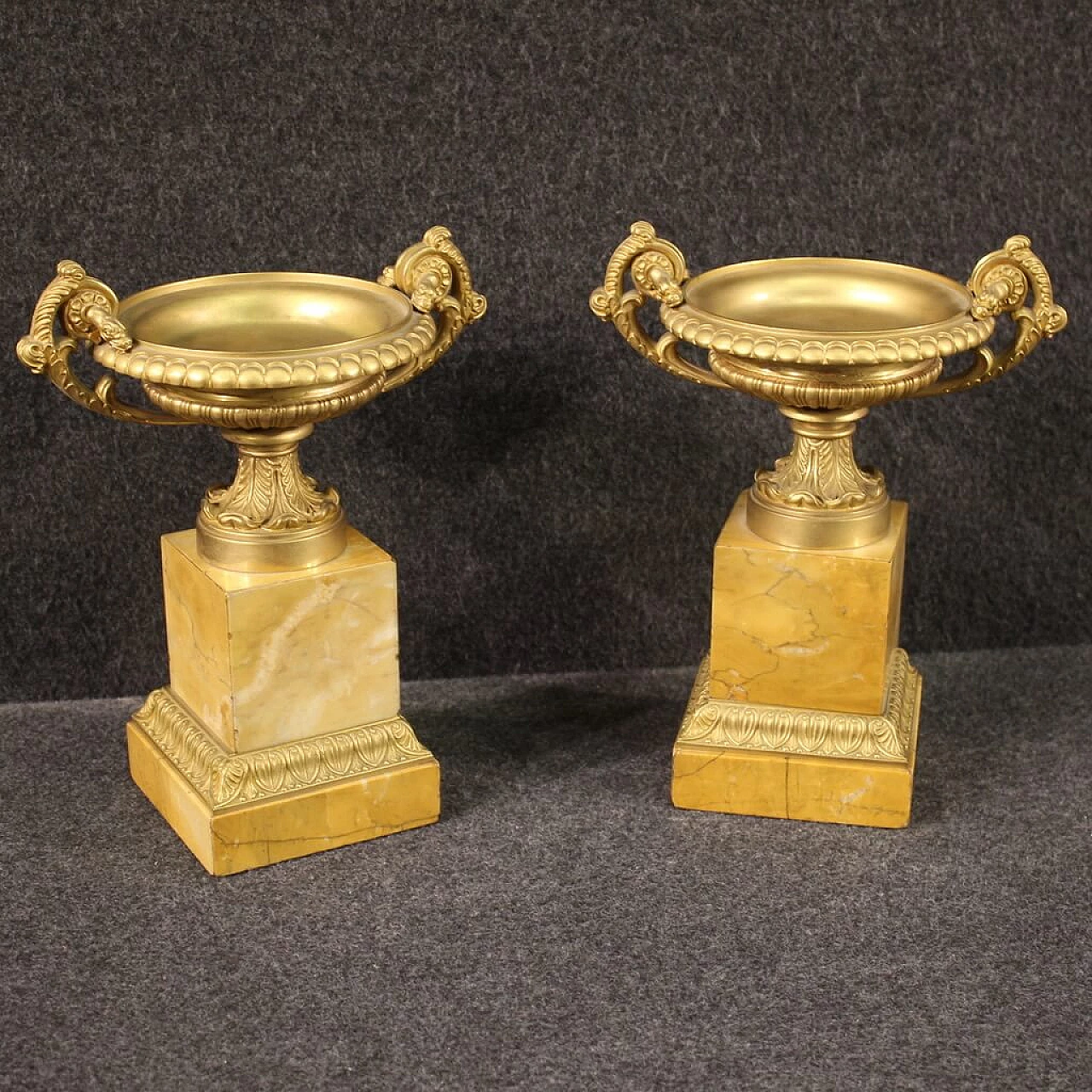 Pair of gilded bronze and yellow marble risers, 1930s 1