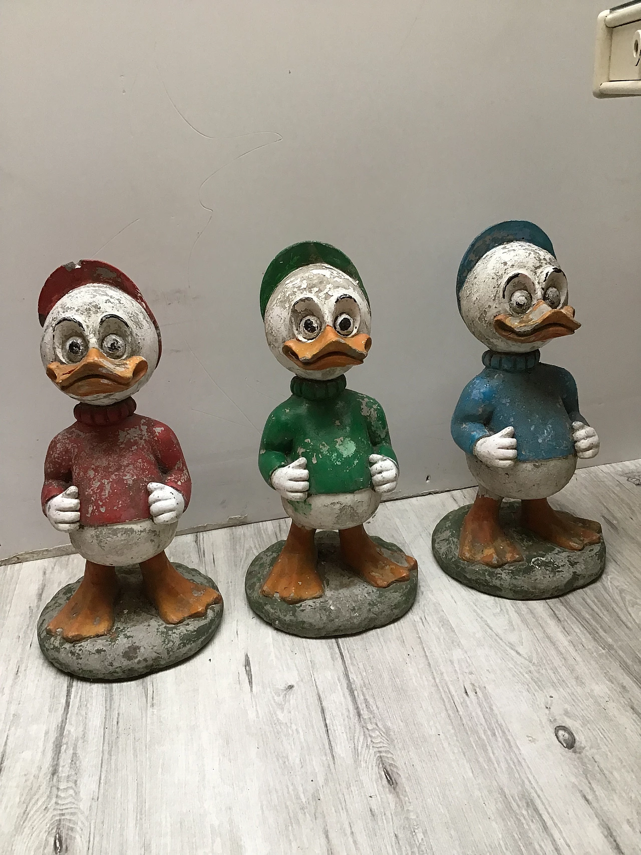 3 Concrete garden sculptures depicting Huey, Dewey and Louie, 1950s 1