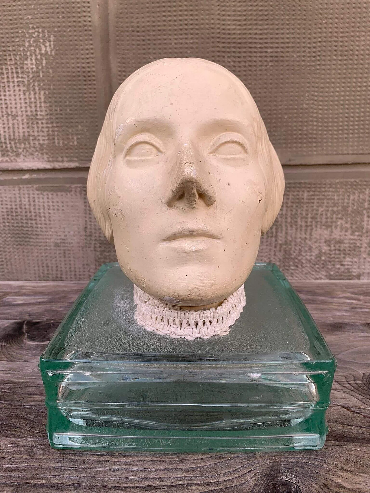 Plaster head of a woman on glass base, early 20th century 1