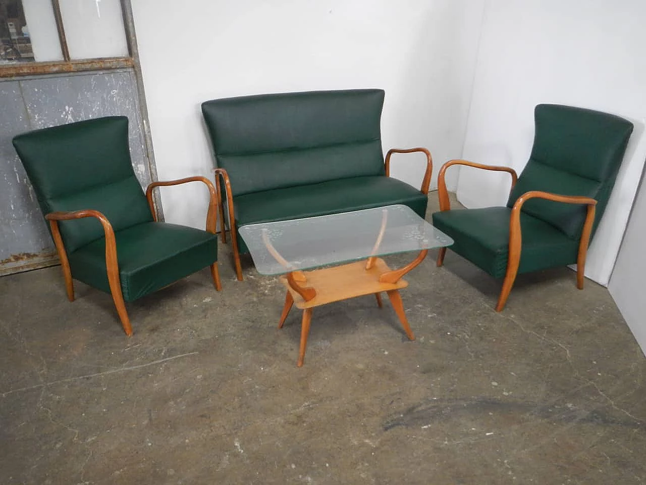 Sofa, pair of armchairs and coffee table in wood, green leatherette and glass, 1950s 1