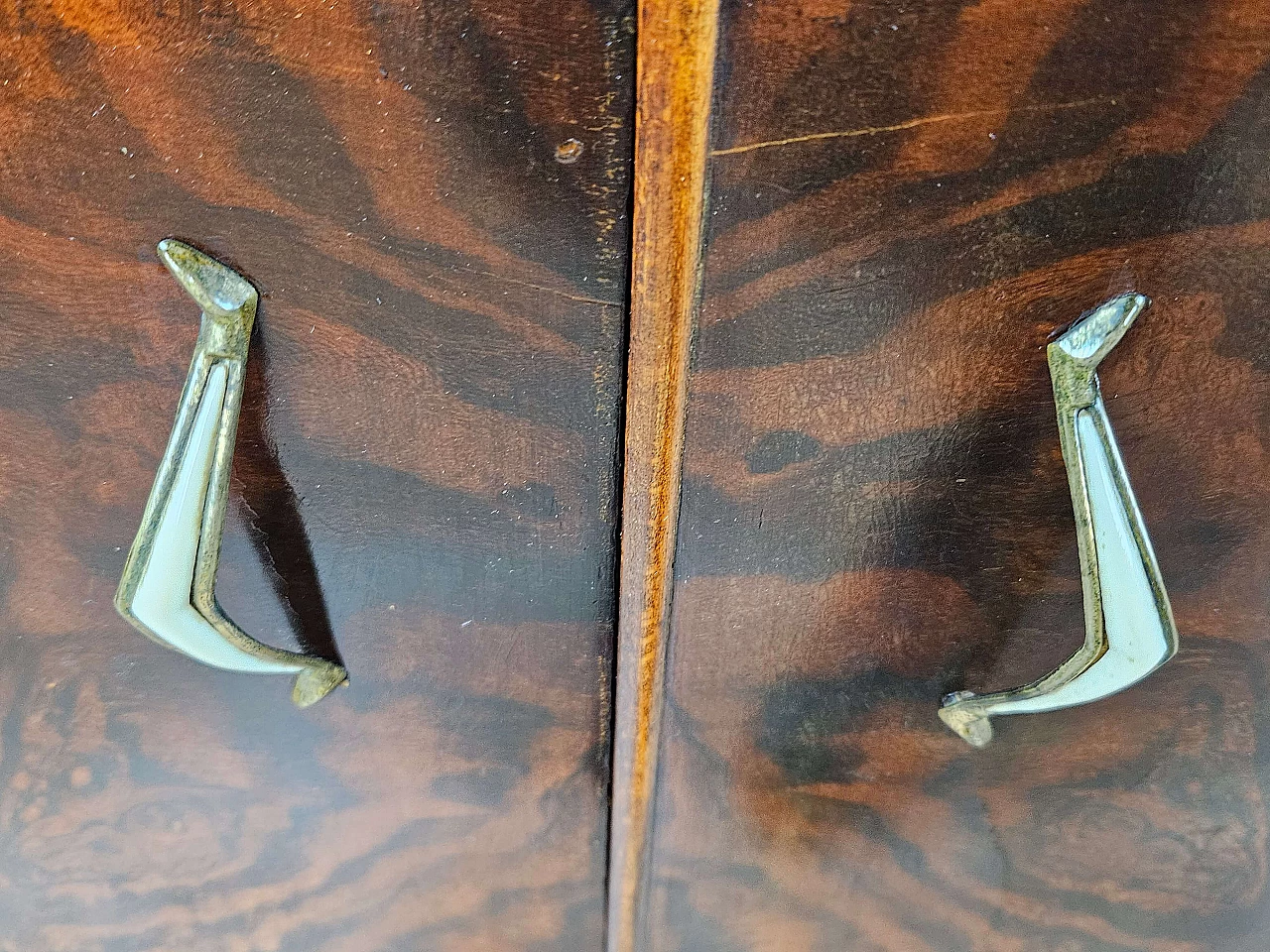 Pair of walnut bedside tables with brass handles and wavy legs, 1950s 17