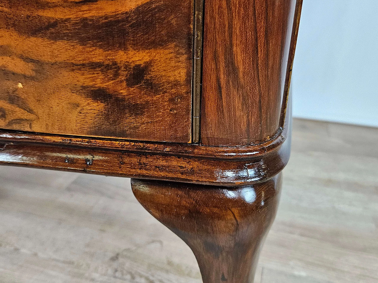 Pair of walnut bedside tables with brass handles and wavy legs, 1950s 24