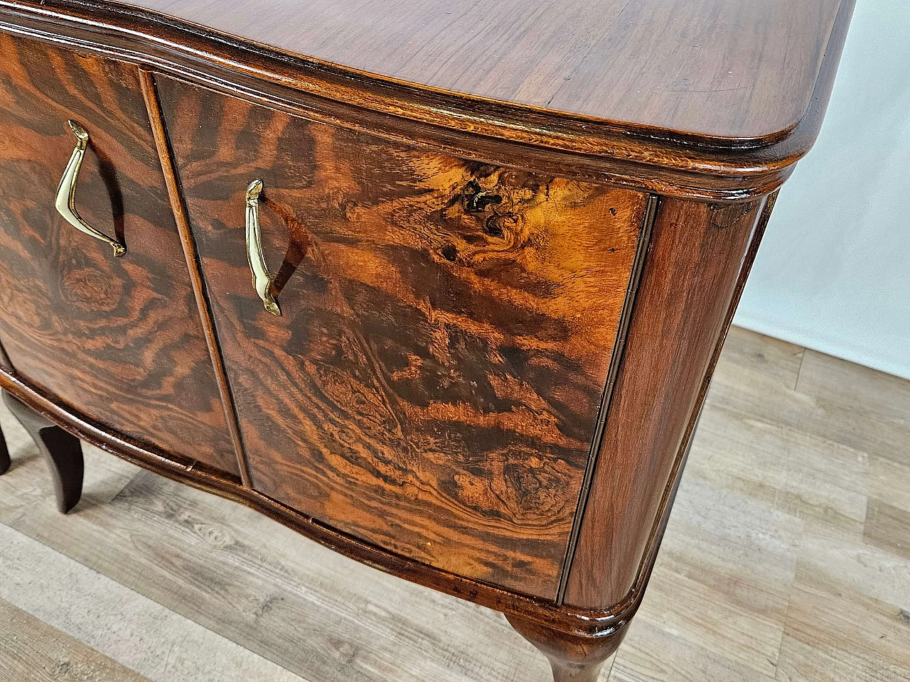 Pair of walnut bedside tables with brass handles and wavy legs, 1950s 25