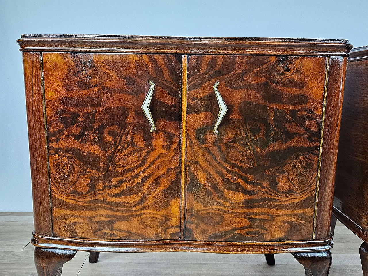 Pair of walnut bedside tables with brass handles and wavy legs, 1950s 27