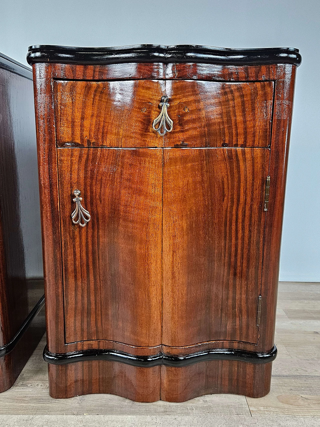 Pair of mahogany and ebony bedside tables with black glass top, 1950s 24