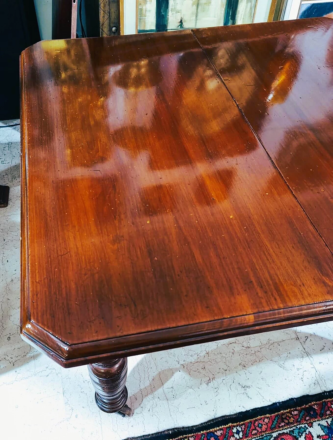 English mahogany extendable table with casters, late 19th century 2