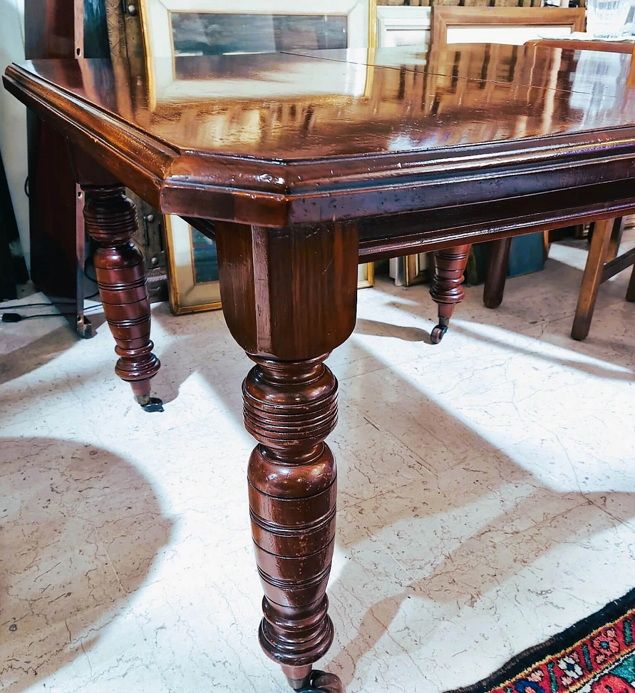 English mahogany extendable table with casters, late 19th century 10