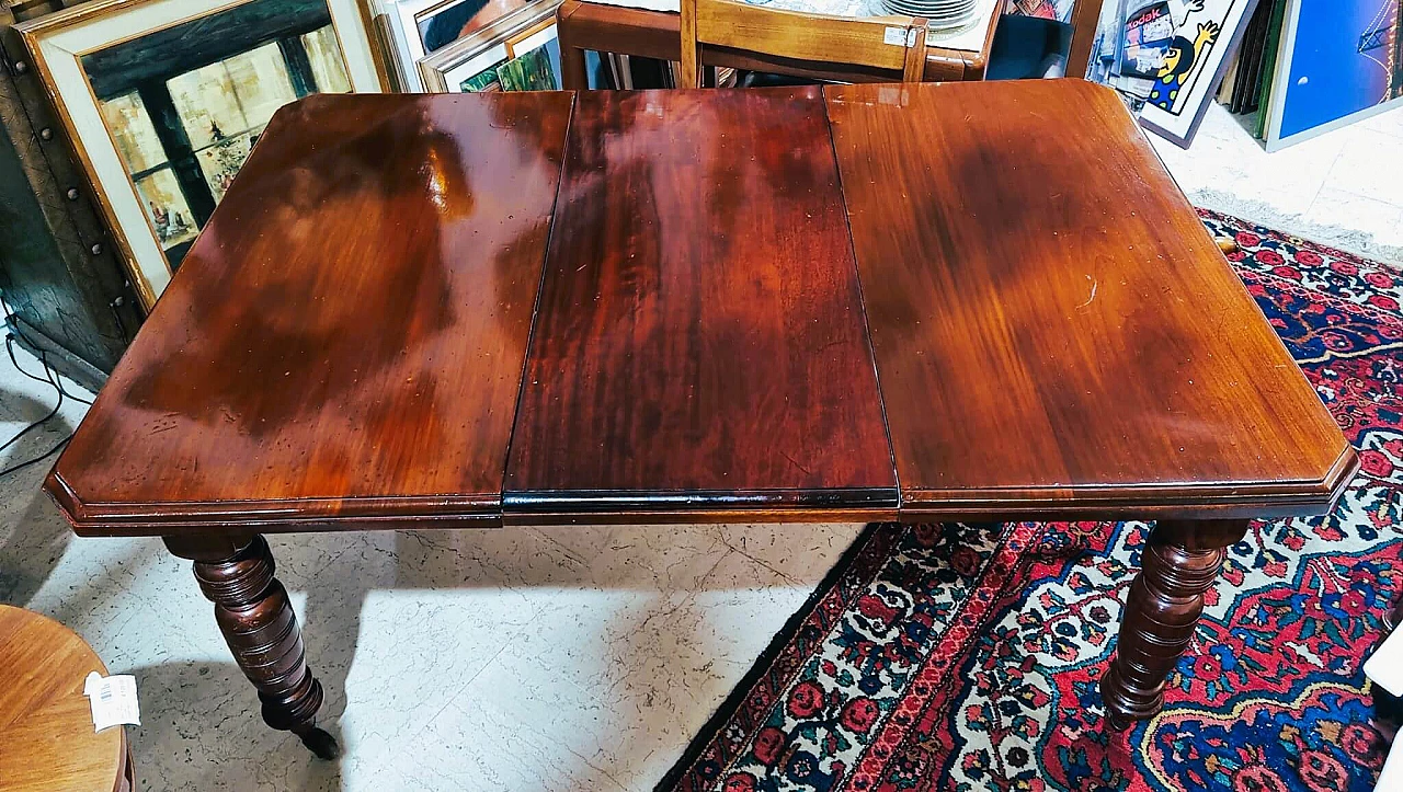 English mahogany extendable table with casters, late 19th century 11