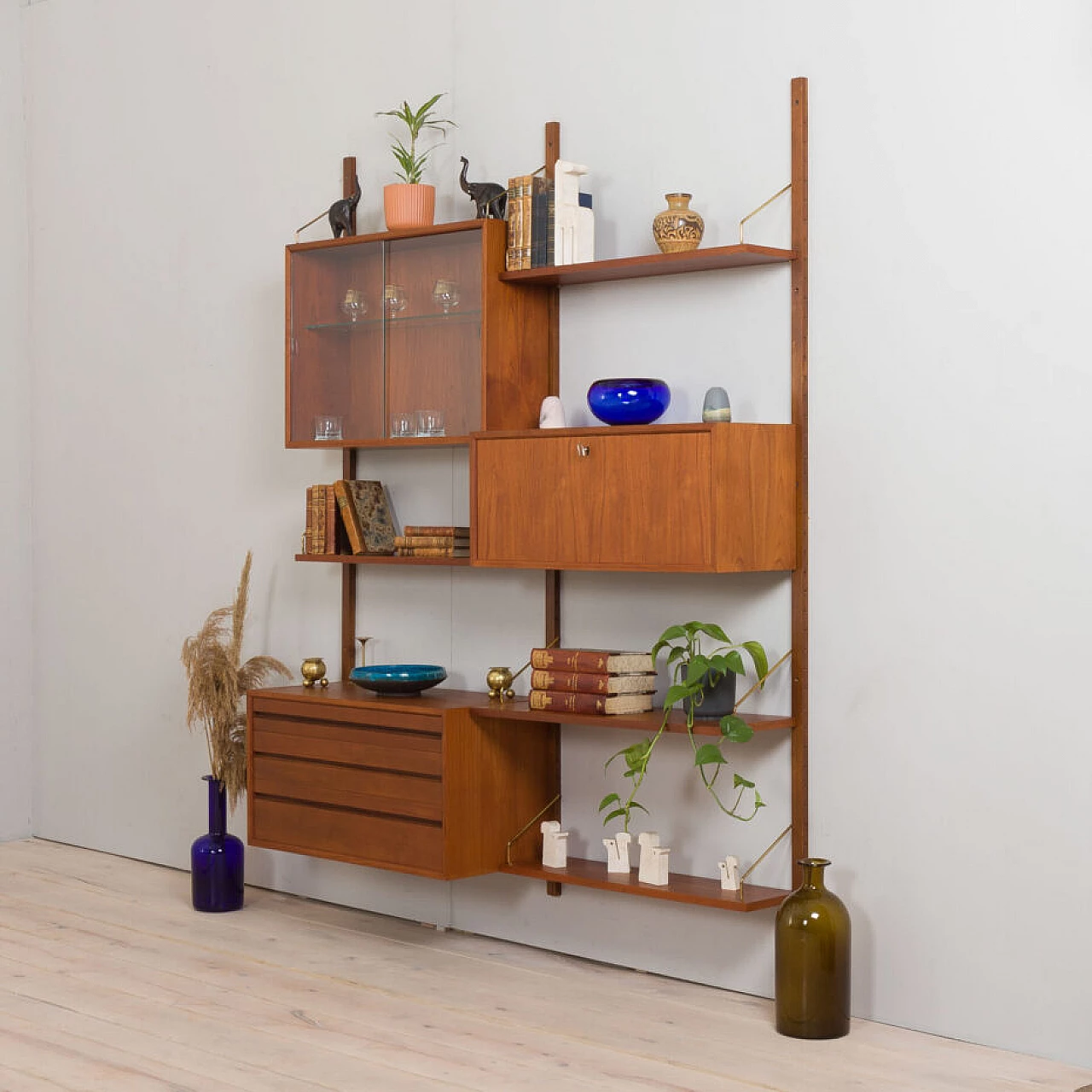 Wall-mounted teak bookcase with bar cabinet and drawer unit by Poul Cadovious for Cado, 1960s 2