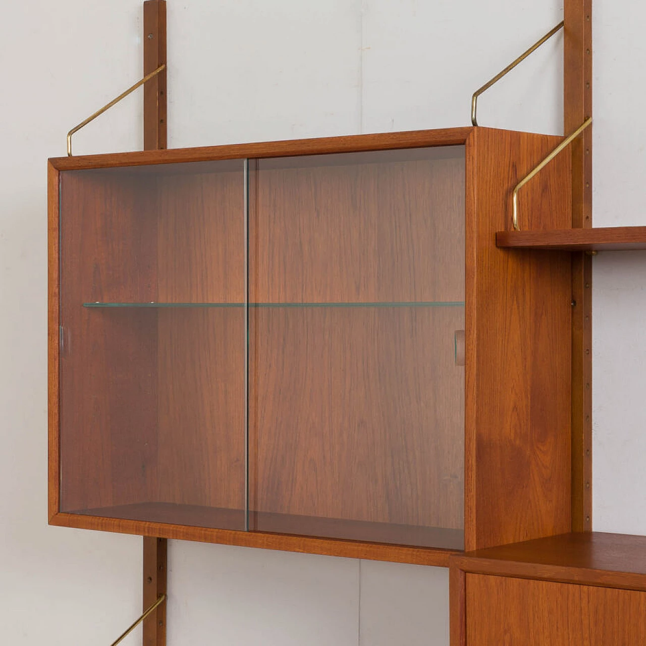 Wall-mounted teak bookcase with bar cabinet and drawer unit by Poul Cadovious for Cado, 1960s 9