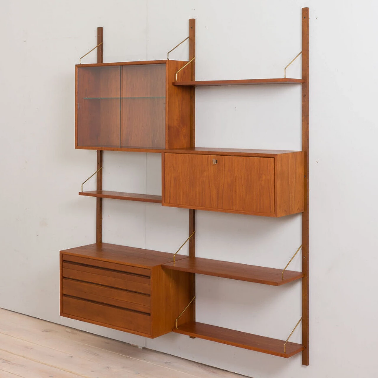 Wall-mounted teak bookcase with bar cabinet and drawer unit by Poul Cadovious for Cado, 1960s 12