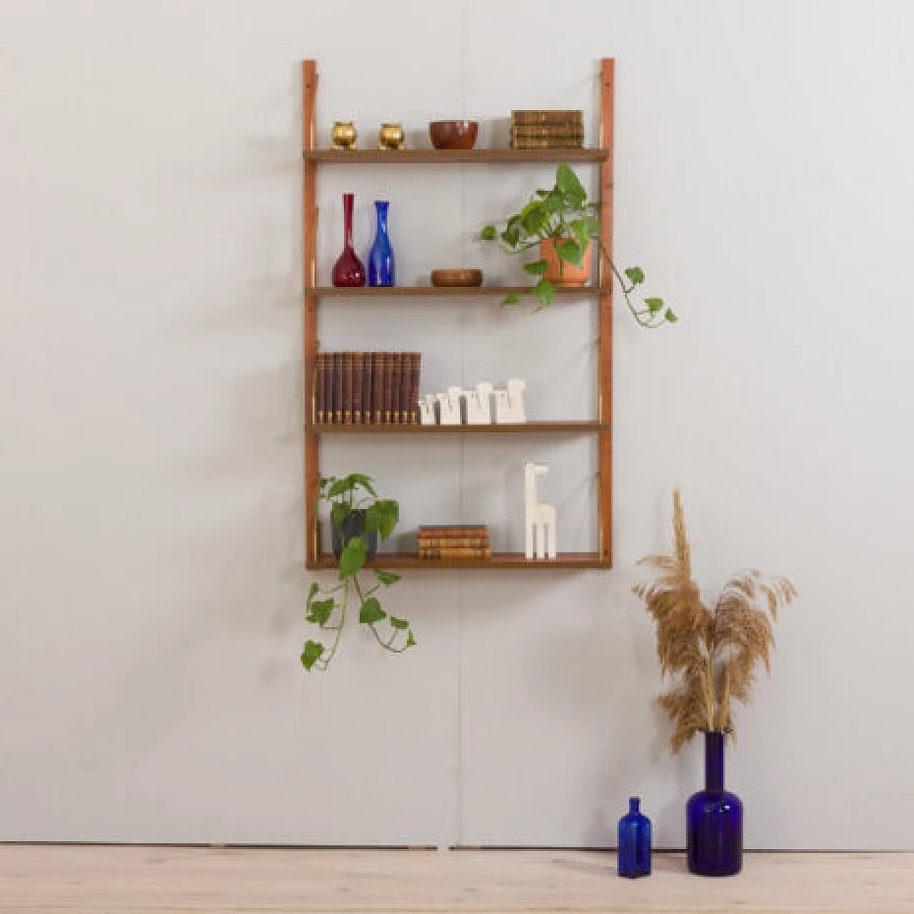 Teak and brass hanging bookcase in the style of Poul Cadovius, 1960s 1