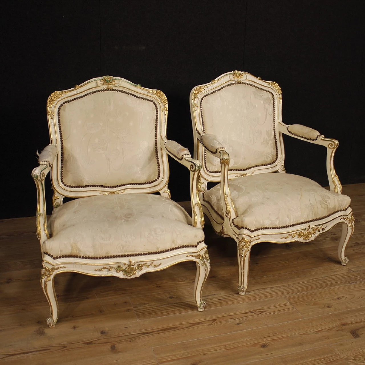 Pair of French carved, lacquered and gilded wood armchairs 1