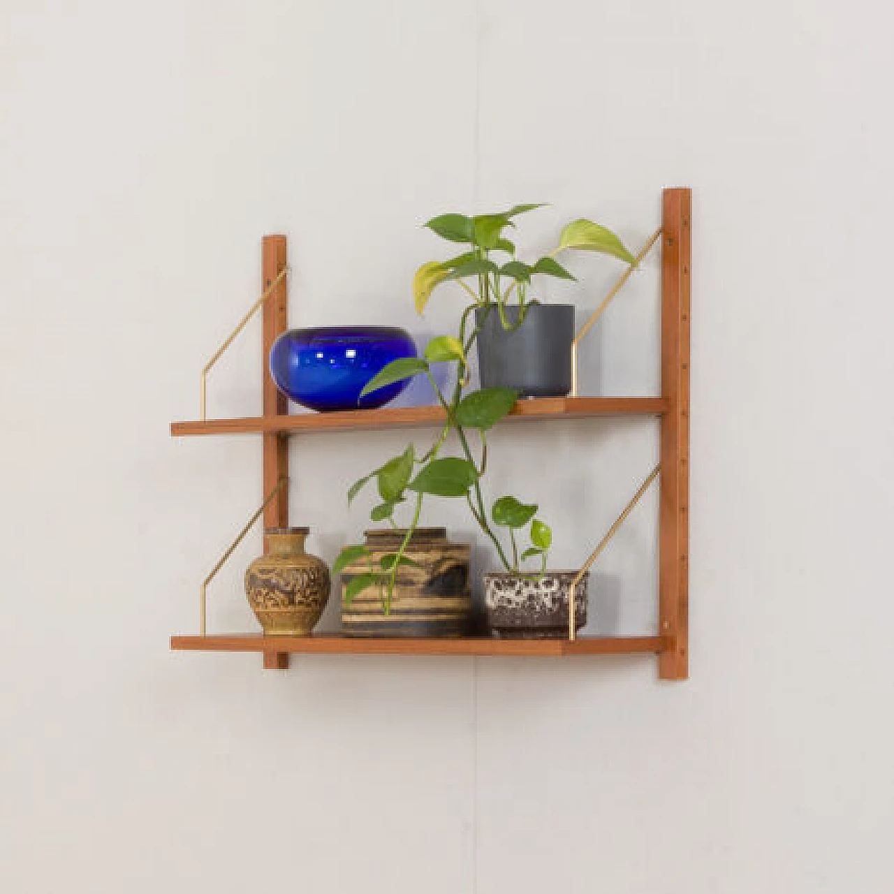 Hanging teak and brass bookcase in the style of Poul Cadovius, 1970s 2