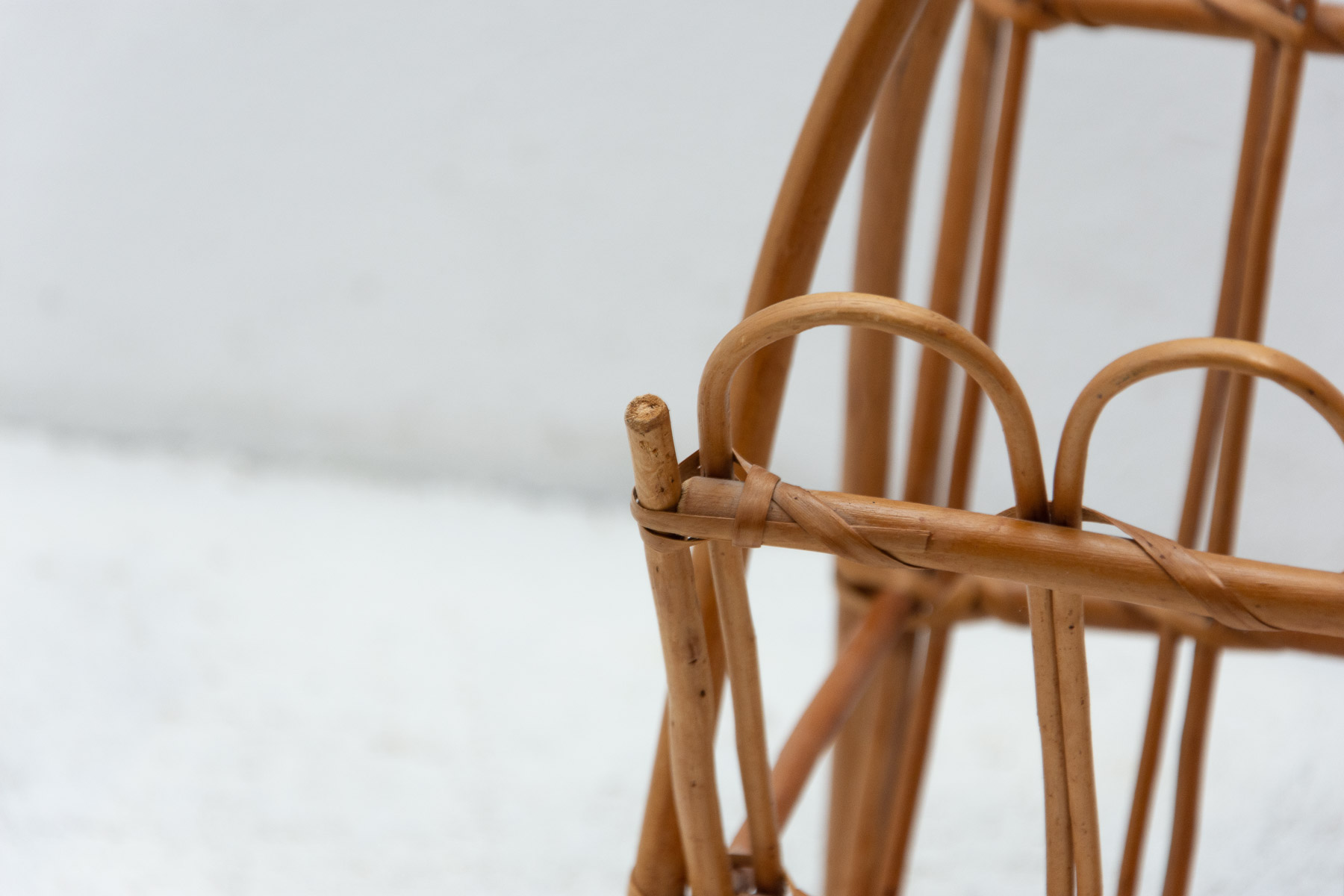 Vintage rattan magazine rack by Jan Kalous for Úluv