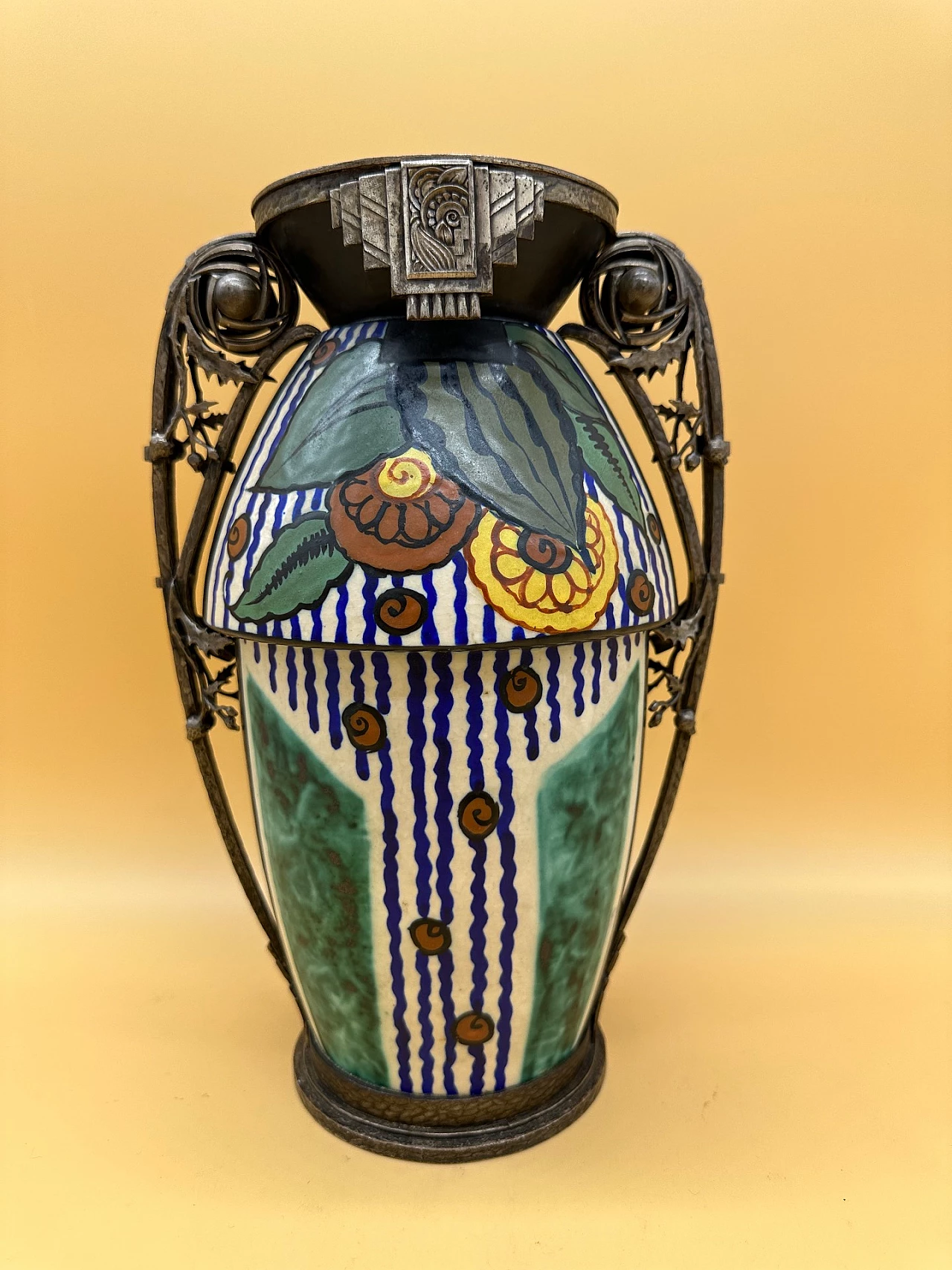 Art Deco ceramic vase with stylised flower decoration and wrought iron frame with leaves with two handles 1