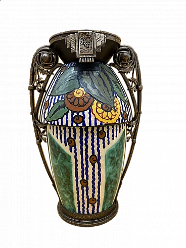 Art Deco ceramic vase with stylised flower decoration and wrought iron frame with leaves with two handles