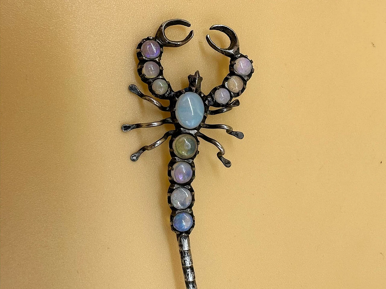 Silver brooch in the shape of a scorpion with various stones, early 1900s 1