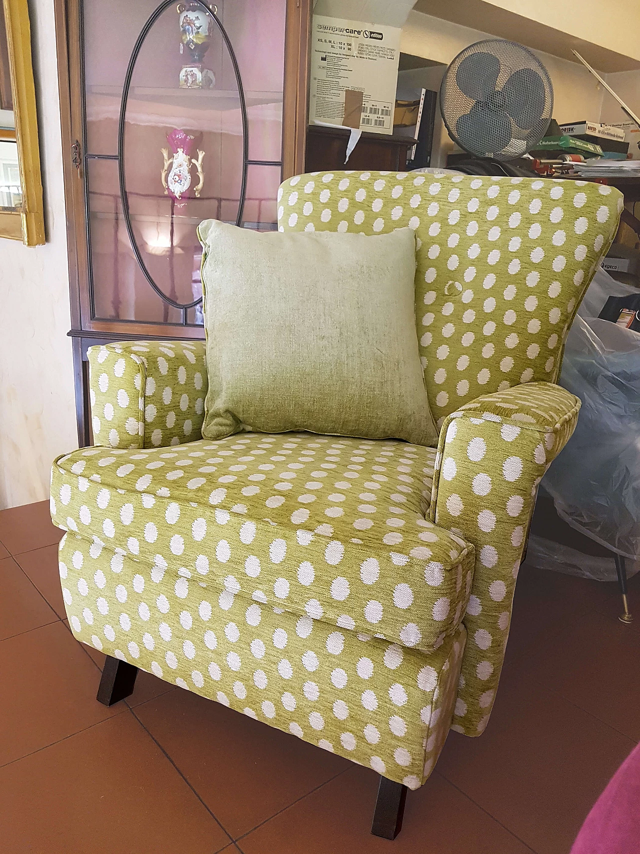 Green fabric armchair with white polka dots 2