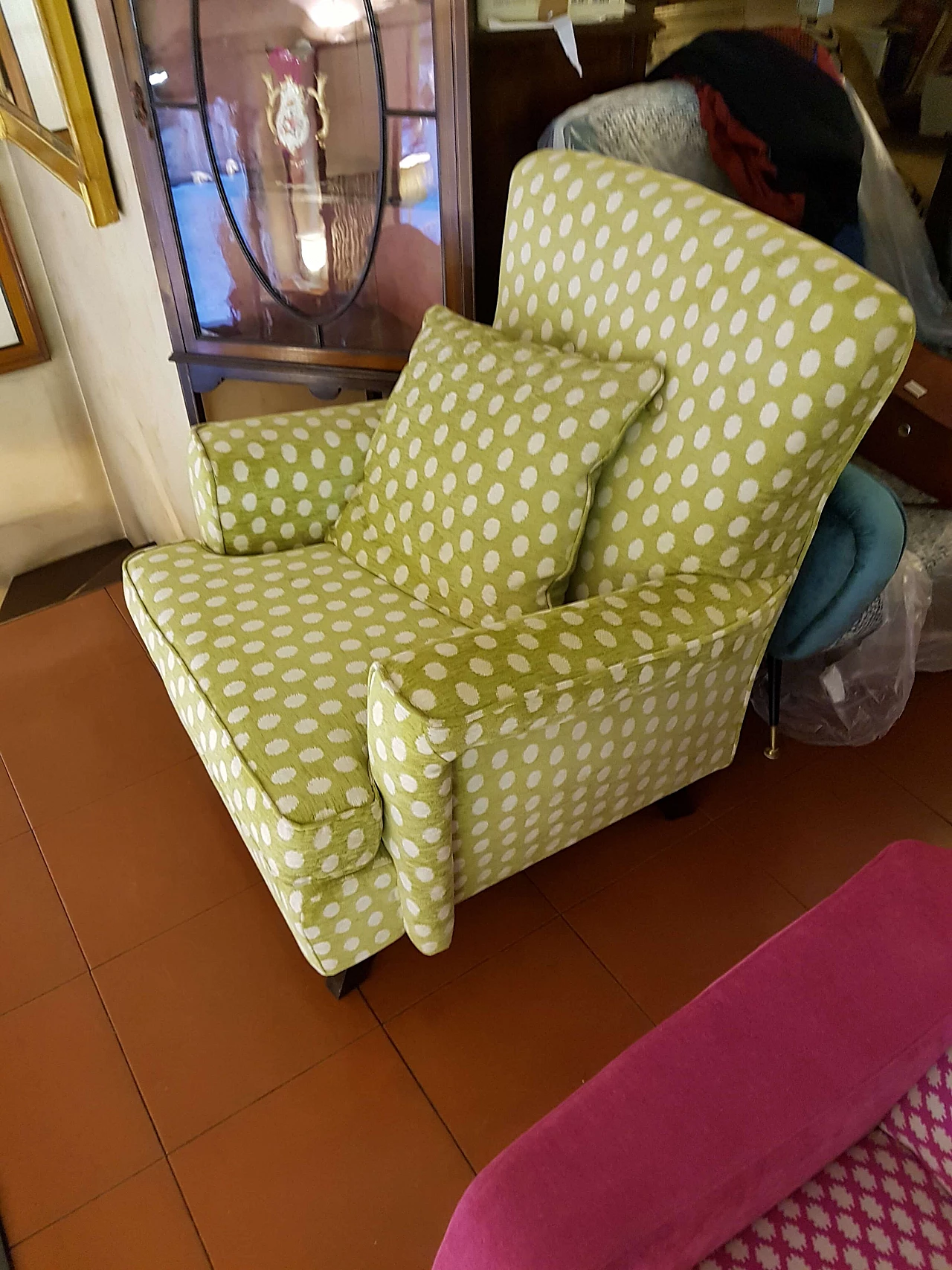 Green fabric armchair with white polka dots 3