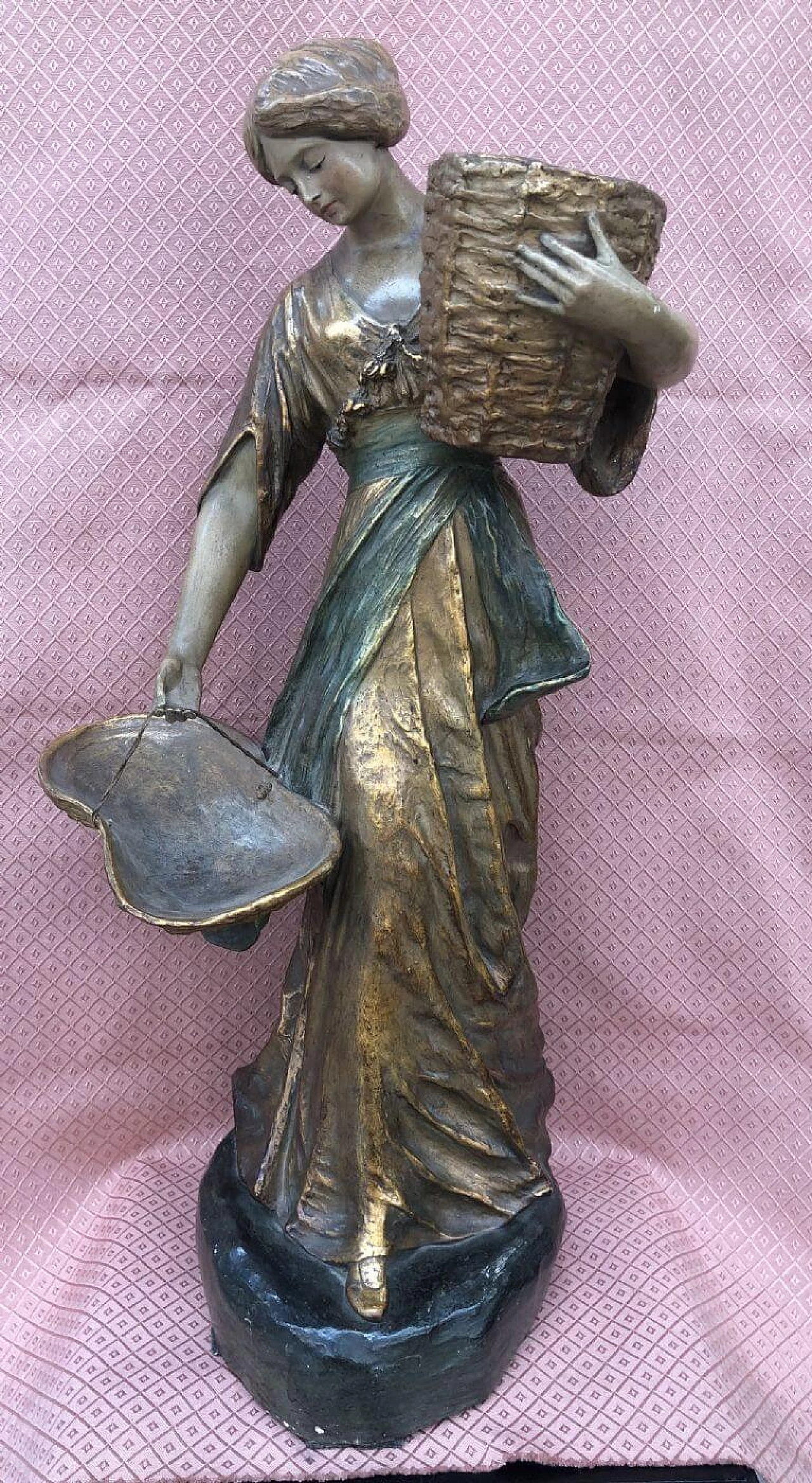 Terracotta sculpture of a young girl with baskets and gold dress, early 20th century 1