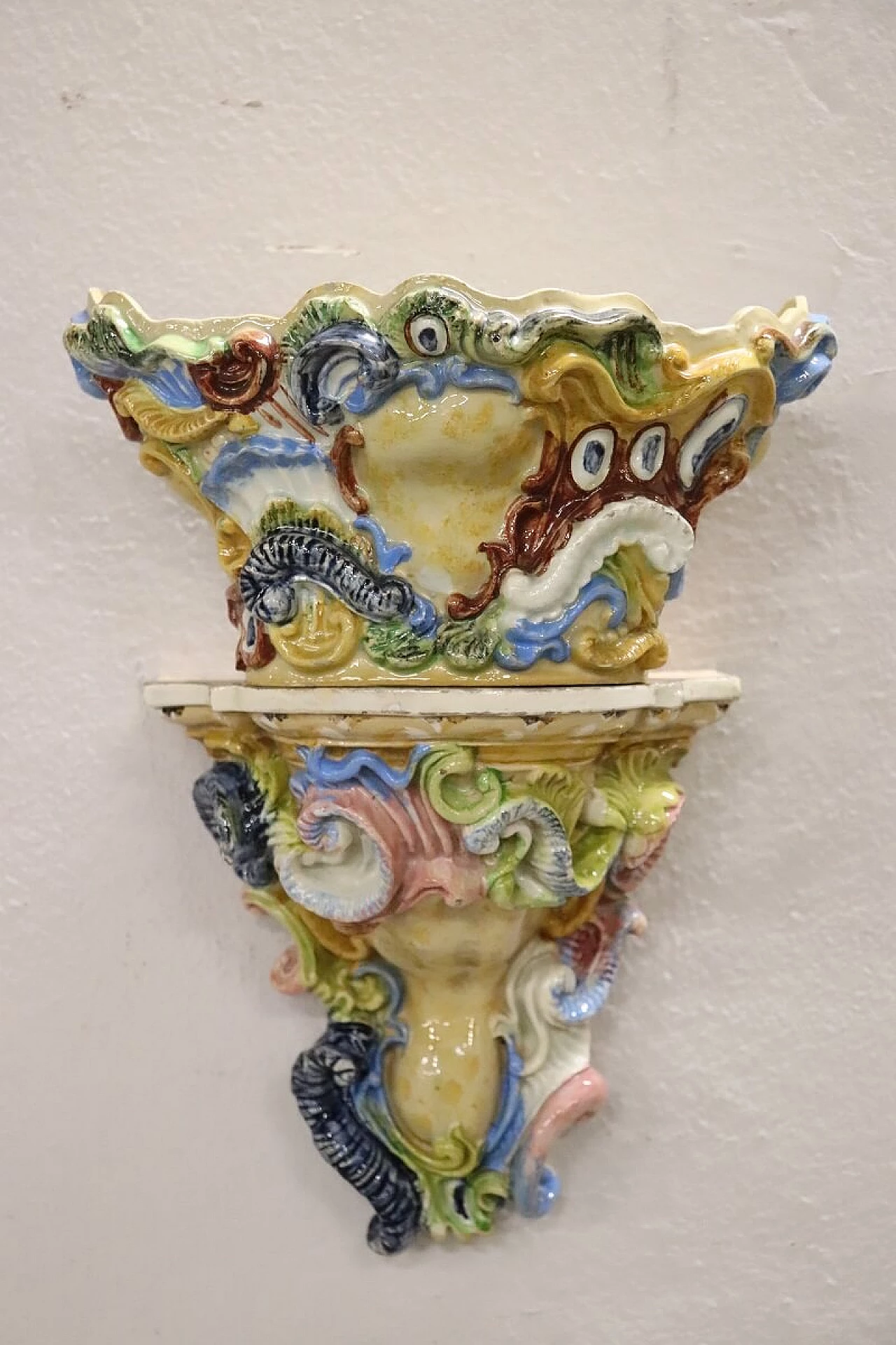 Pair of painted majolica shelves with vase, late 19th century 2