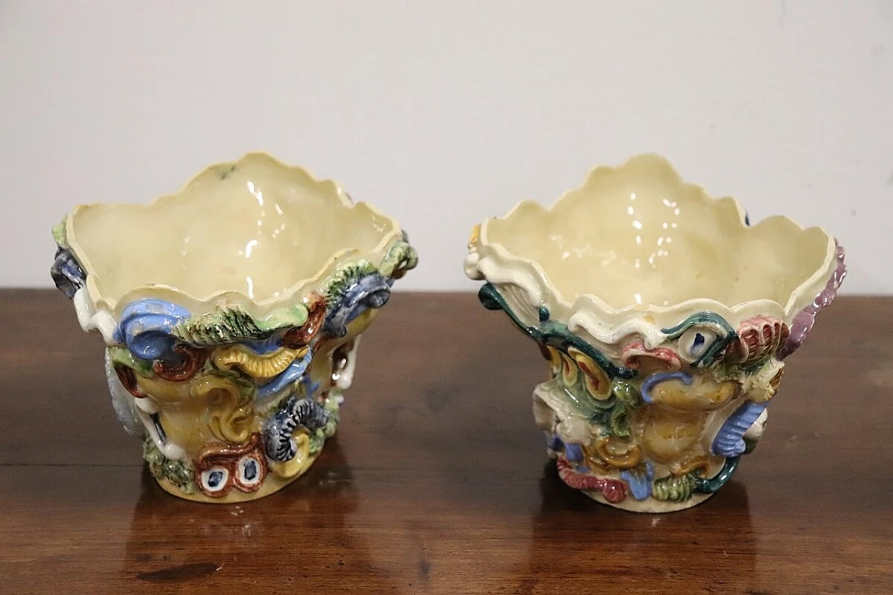 Pair of painted majolica shelves with vase, late 19th century 16