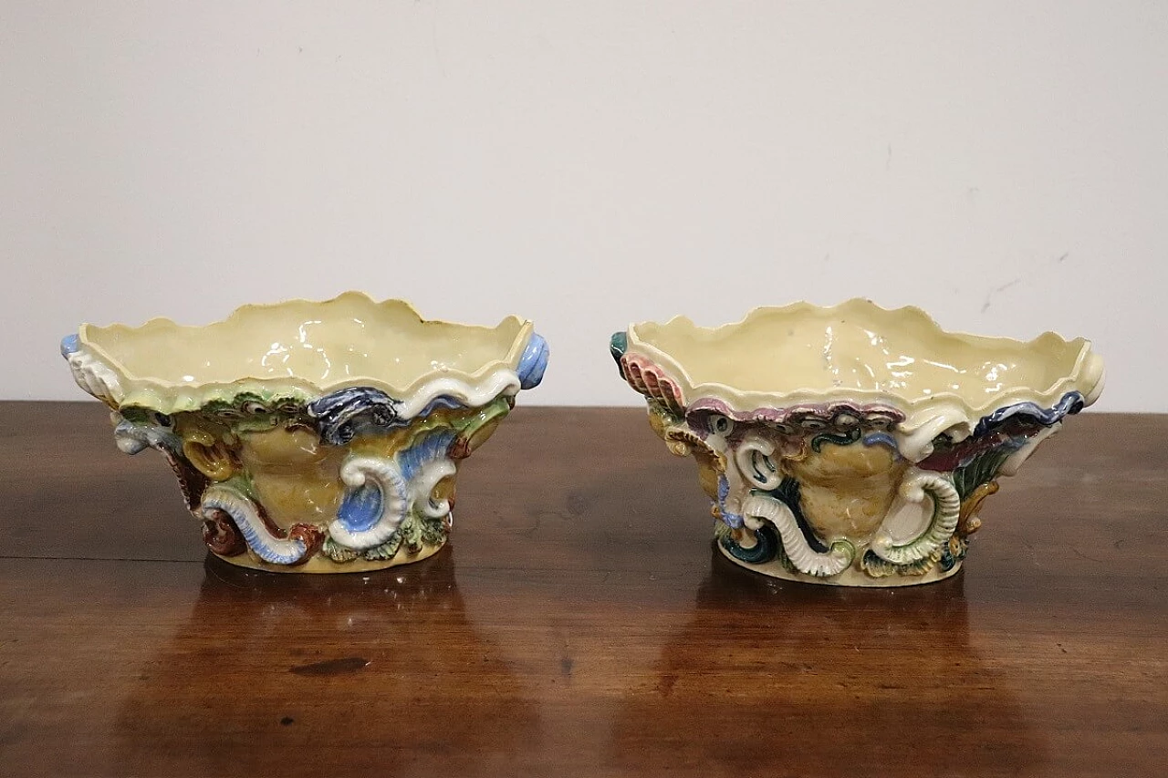 Pair of painted majolica shelves with vase, late 19th century 17