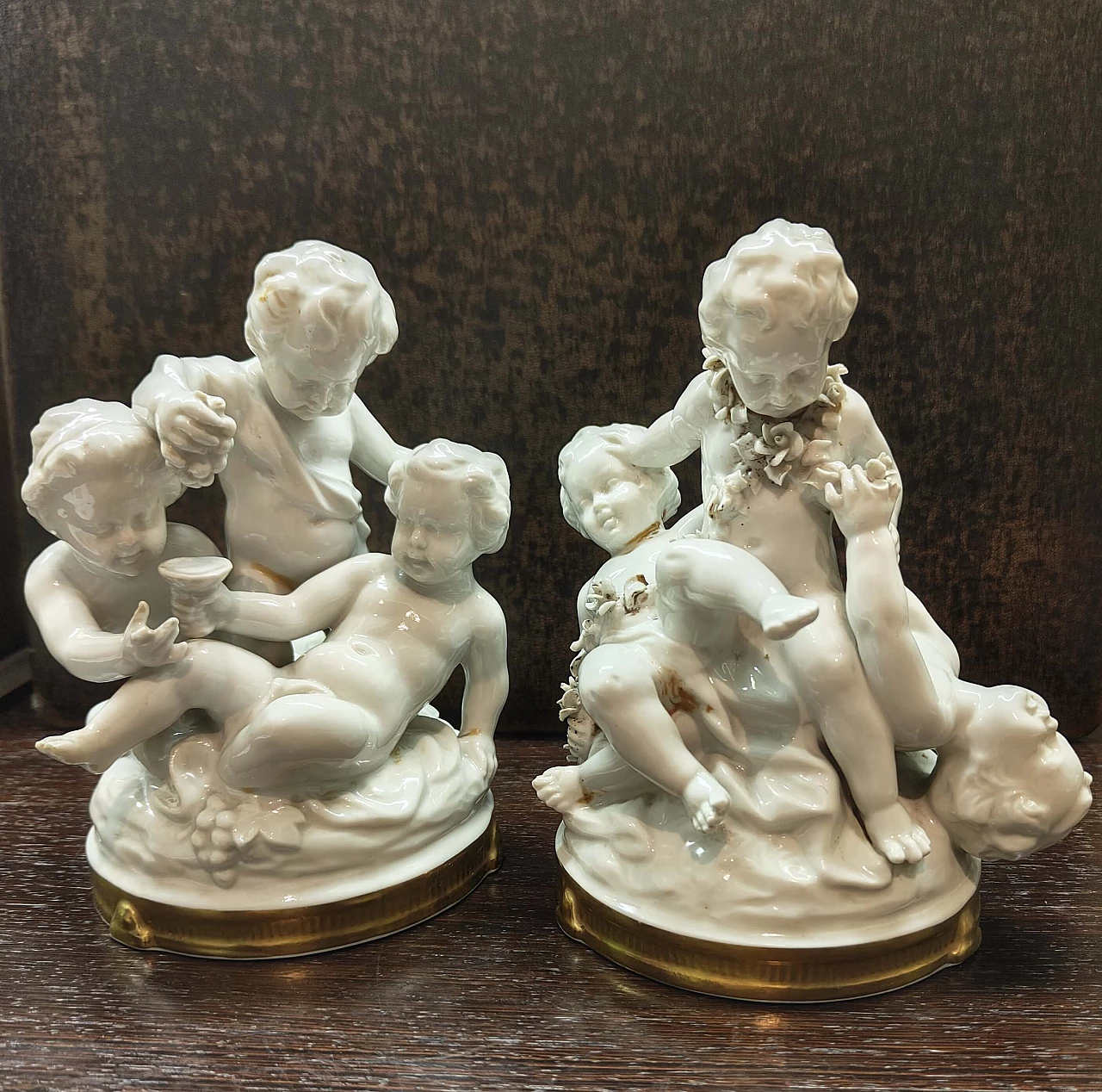 Groups of cupids, pair of Capodimonte porcelain sculptures, 1950s 1