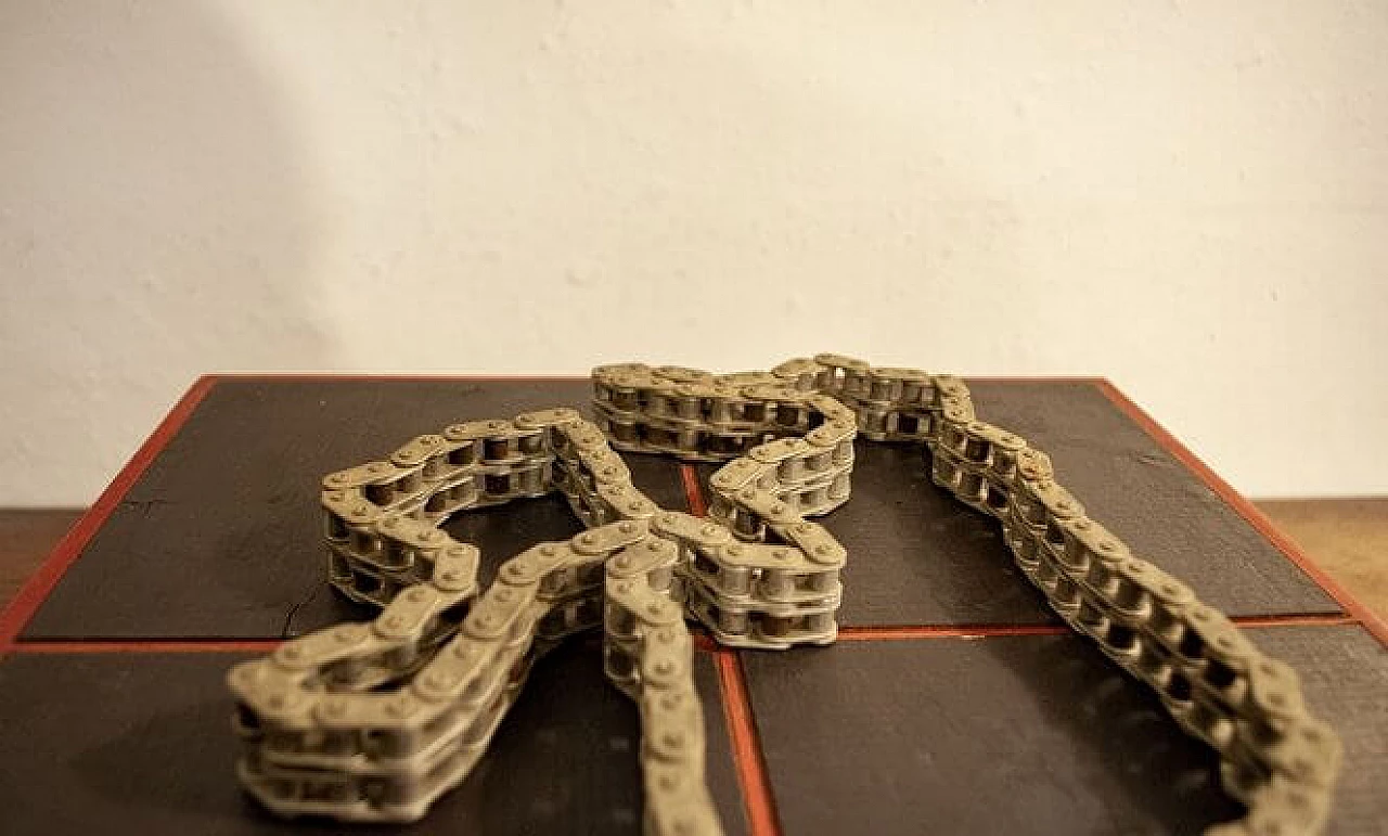 Paolo Tilche, sculpture of a magnetized chain on wood, 1970s 5