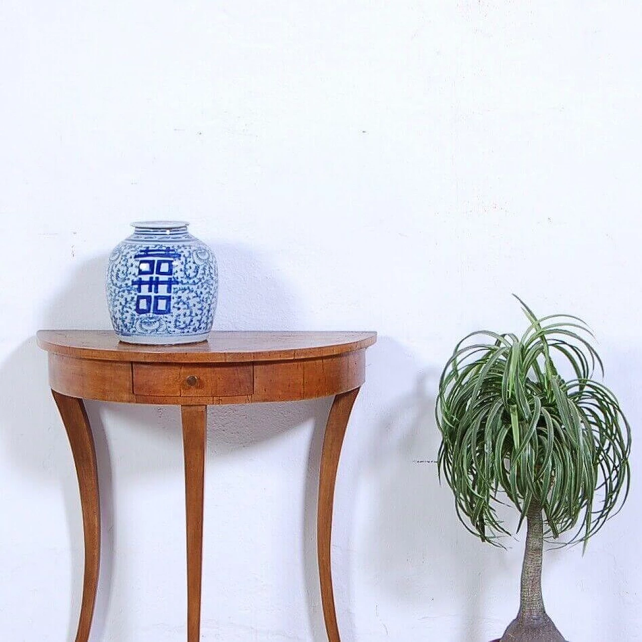 Walnut-root crescent-shaped console table with sabre legs, early 20th century 2