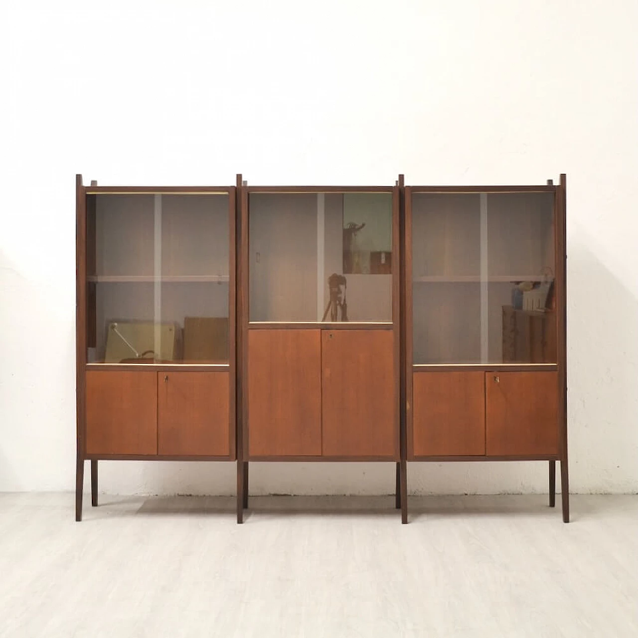 Three-bay wood cabinet with glass sliding doors, 1958 1