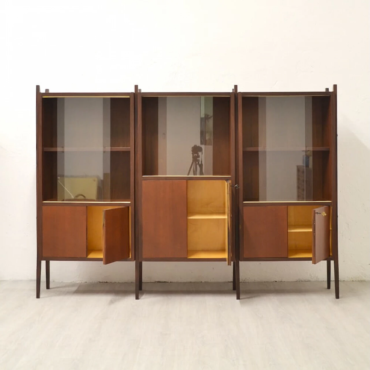 Three-bay wood cabinet with glass sliding doors, 1958 2