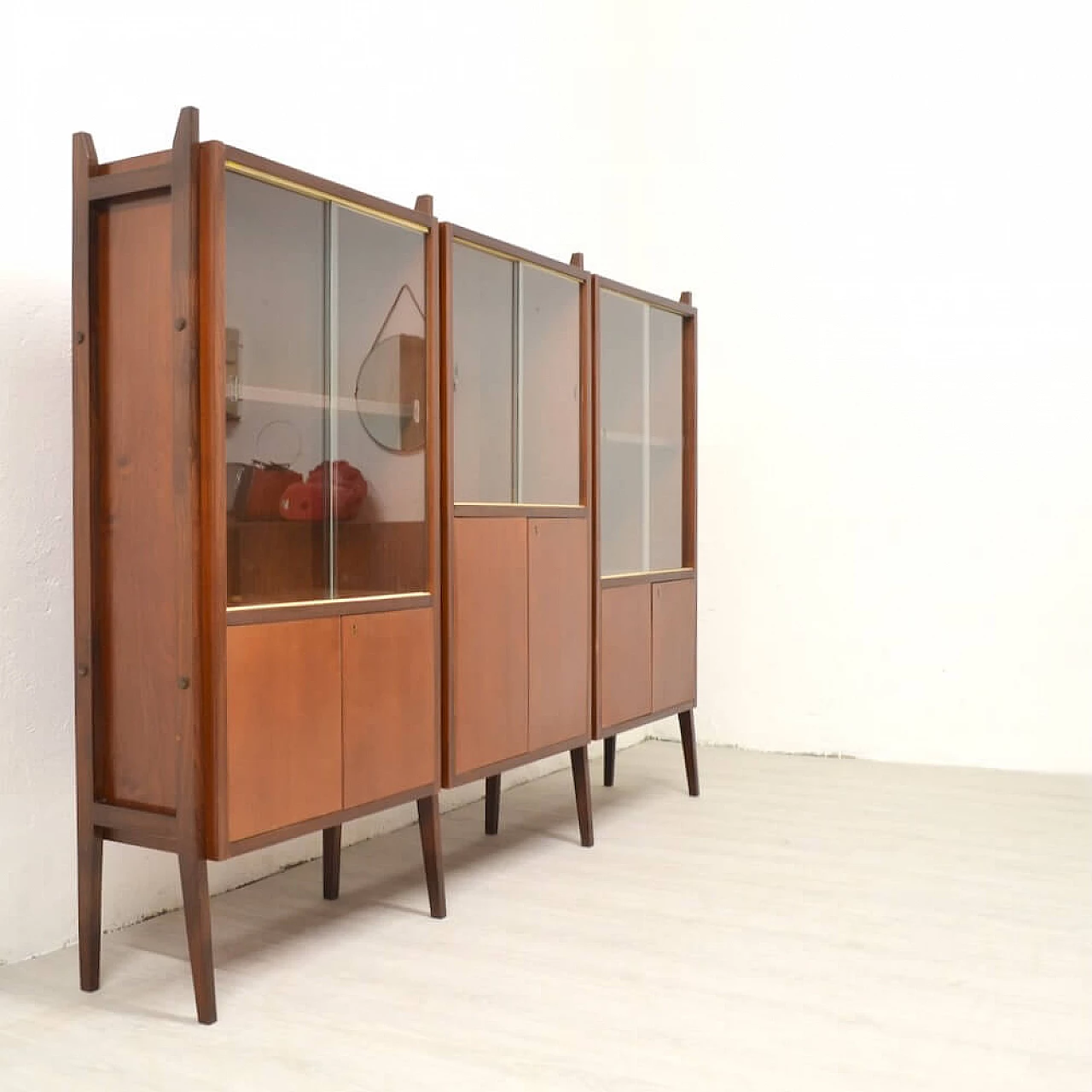 Three-bay wood cabinet with glass sliding doors, 1958 7