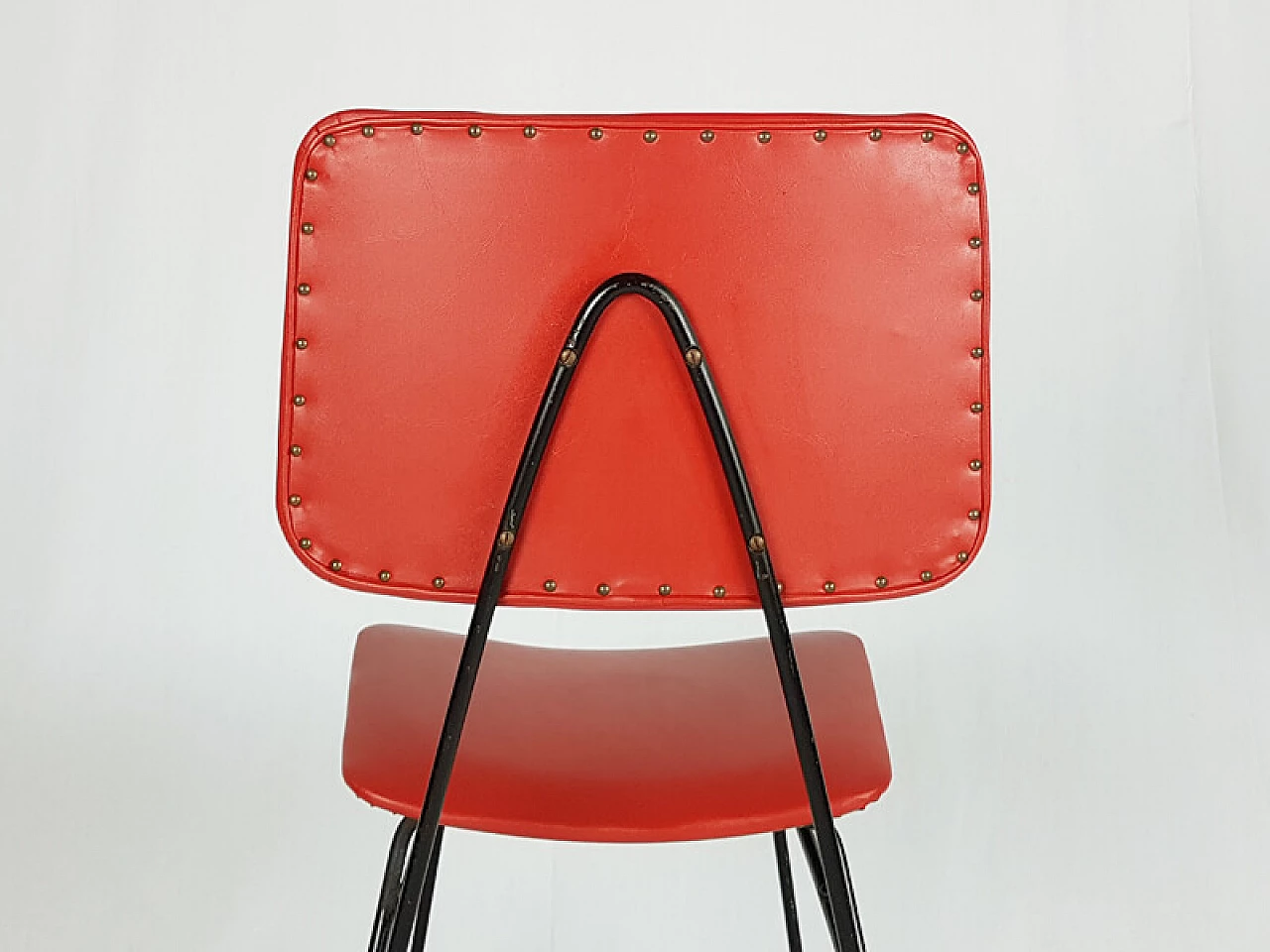 Pair of black metal and red skai chairs, 1950s 4